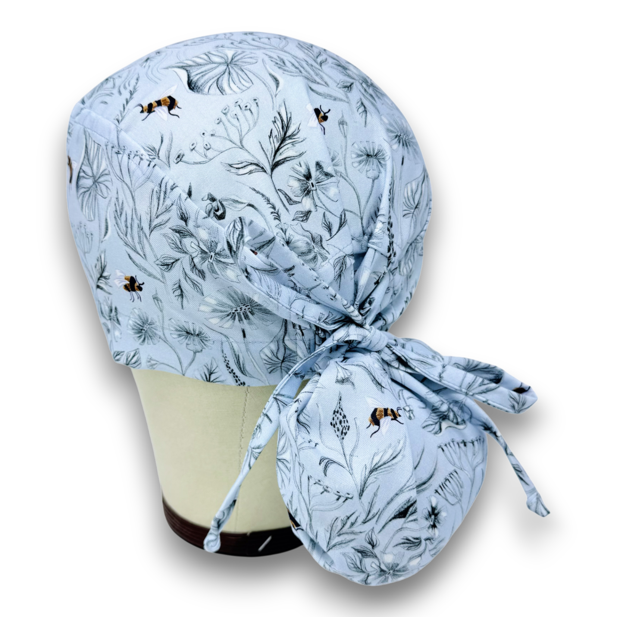 Glacier Pollinators Ponytail scrub cap for women with satin lined option by Paradise Caps.