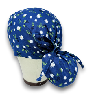 Ponytail scrub cap for women. Navy Daisy surgical hat for women with satin lined option by Paradise Caps.