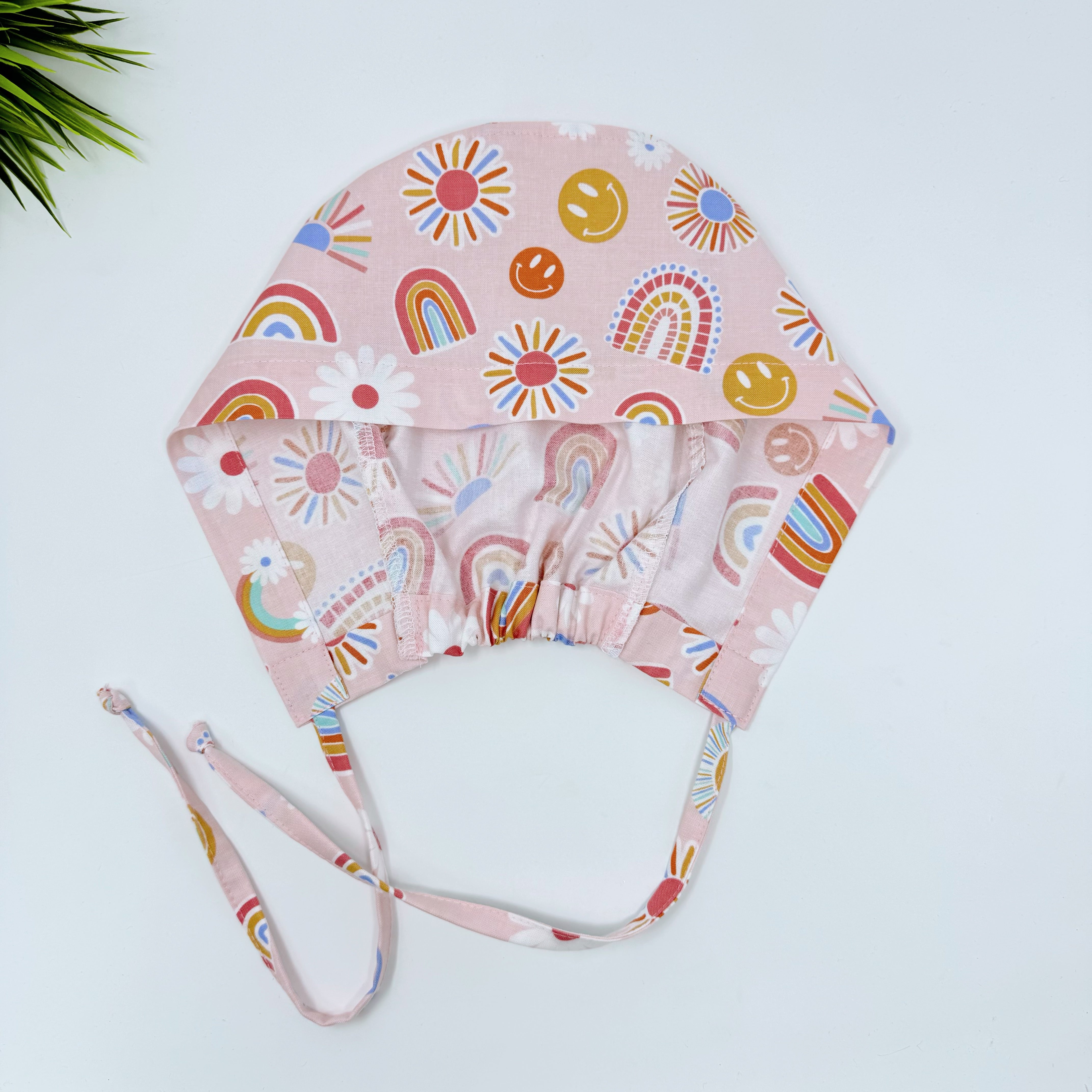 Rainbows Skull tie-back style surgical scrub cap for men by Paradise Caps.