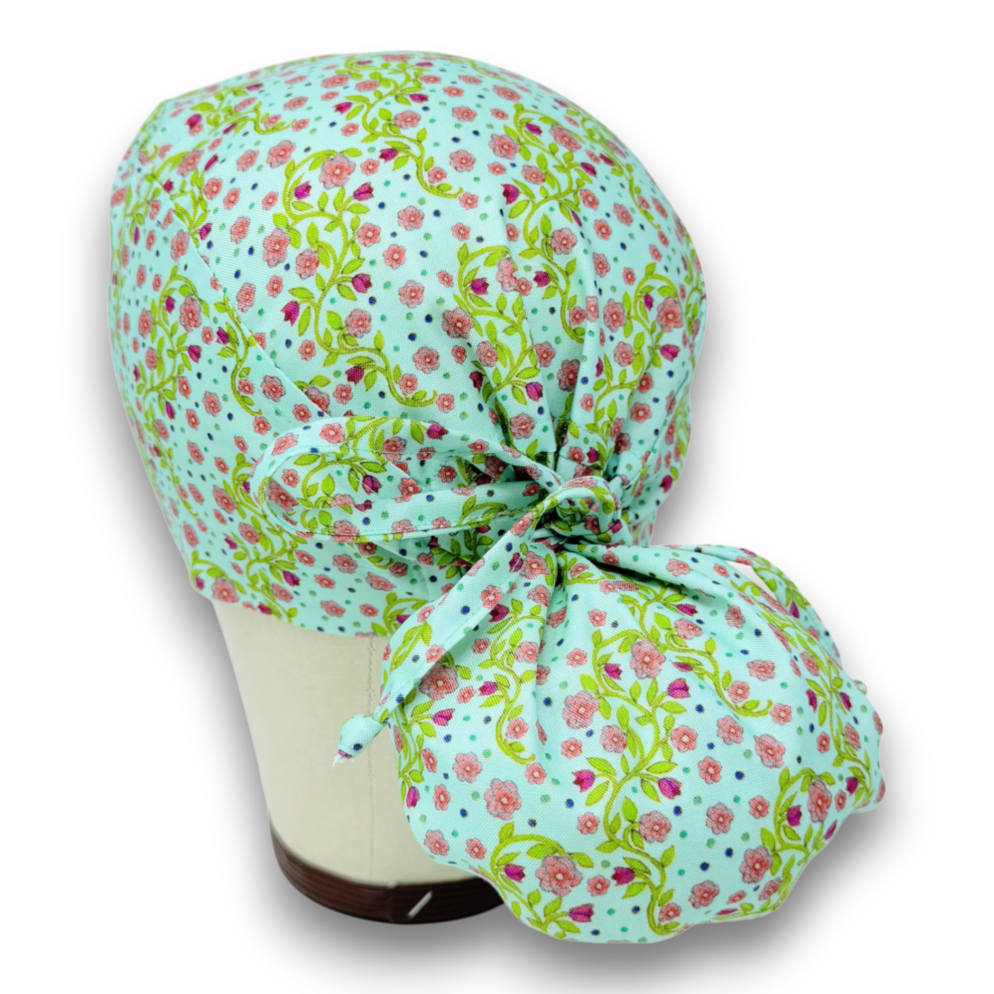 Pink flower Ponytail scrub cap for women with satin lined option by Paradise Caps.
