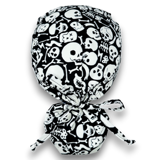 Glow Tossed Skulls Ponytail scrub cap for women with satin lined option by Paradise Caps. Glows in the Dark!