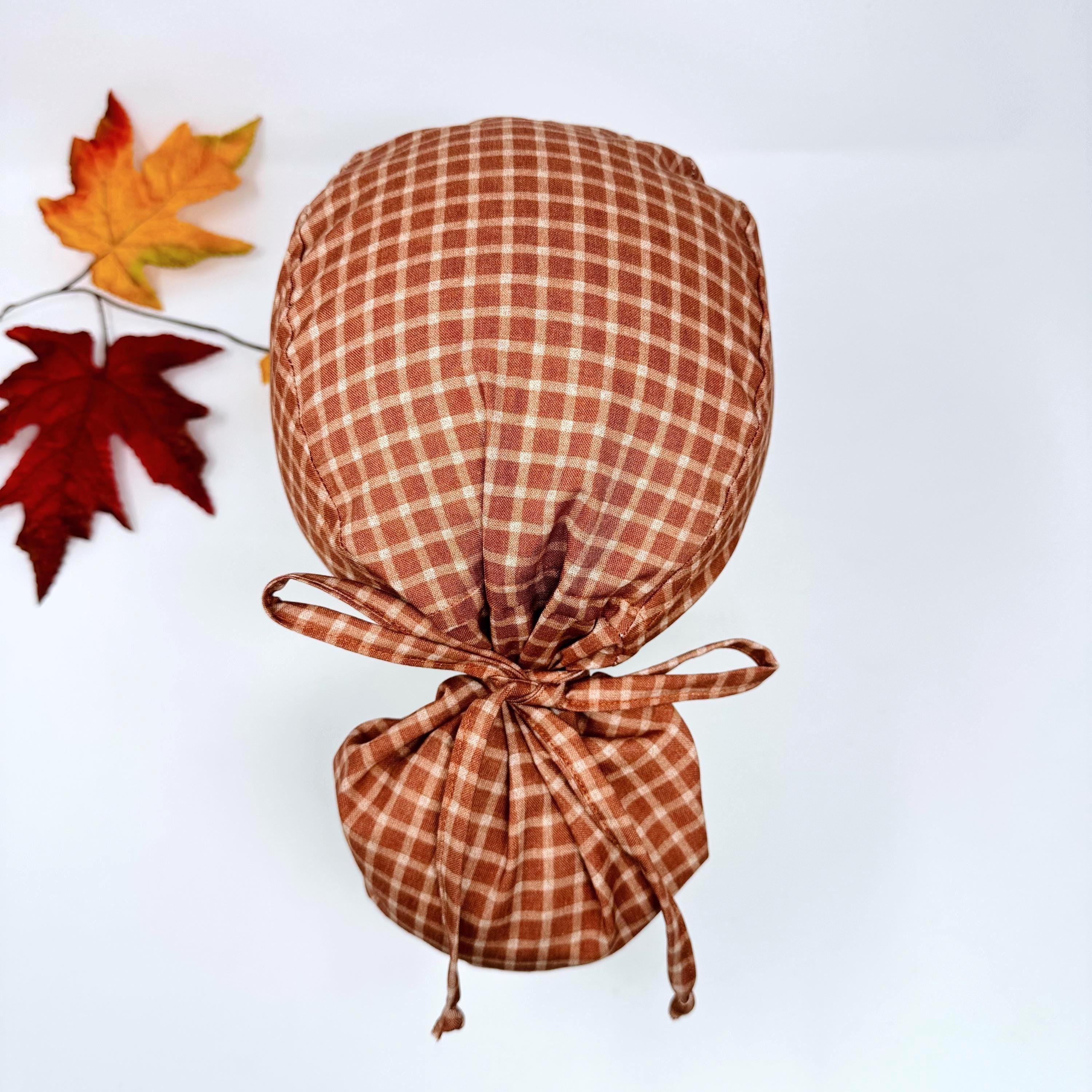 Rustic Check Ponytail scrub cap for women. Rust Surgical cap with ponytail, satin lined option by Paradise Caps.