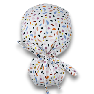 Ponytail surgical scrub cap for women. Spring Petals Scrub hat for women with satin lined option by Paradise Caps.