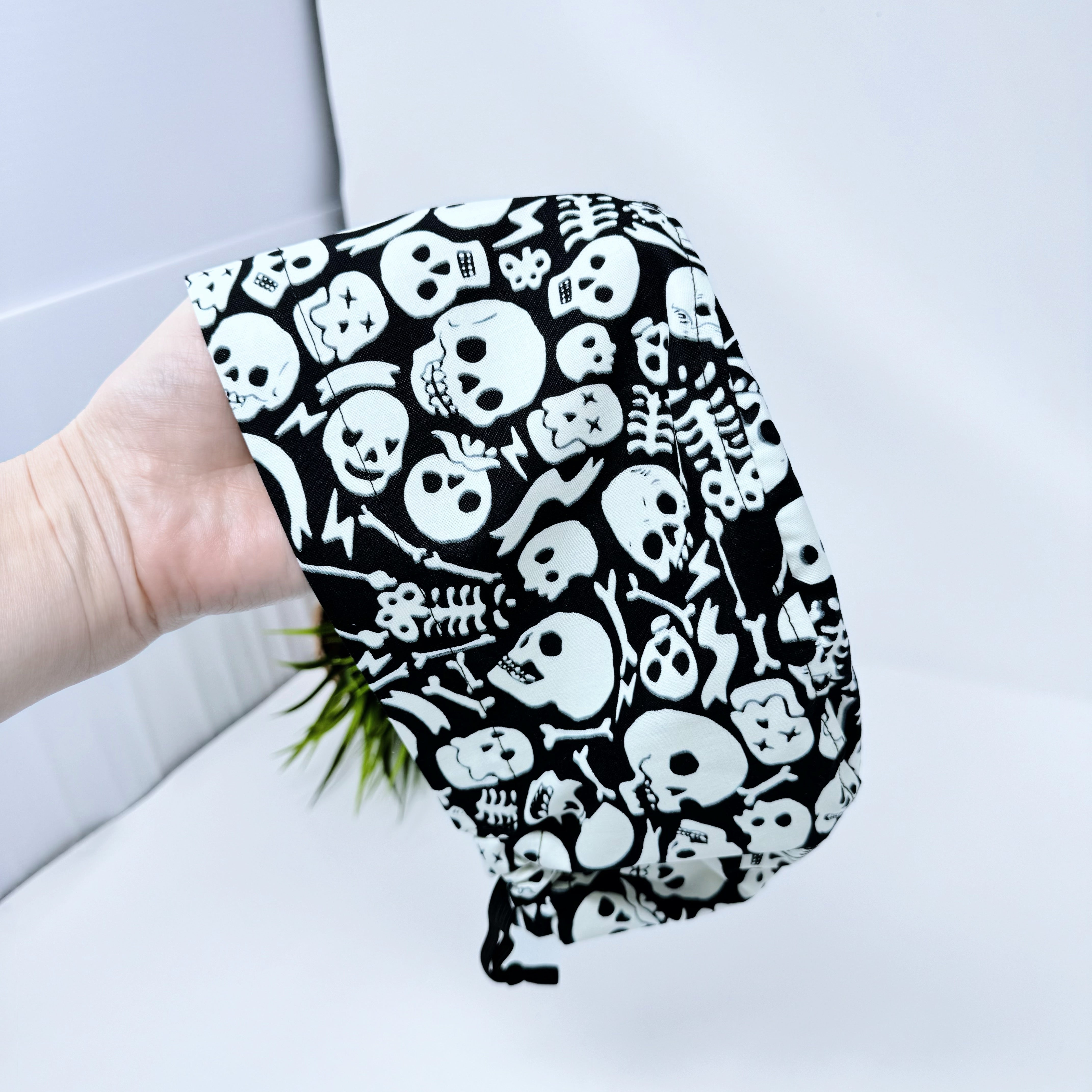 Tossed Skulls Skull tie-back style surgical scrub cap for men by Paradise Caps. Glows in the Dark!