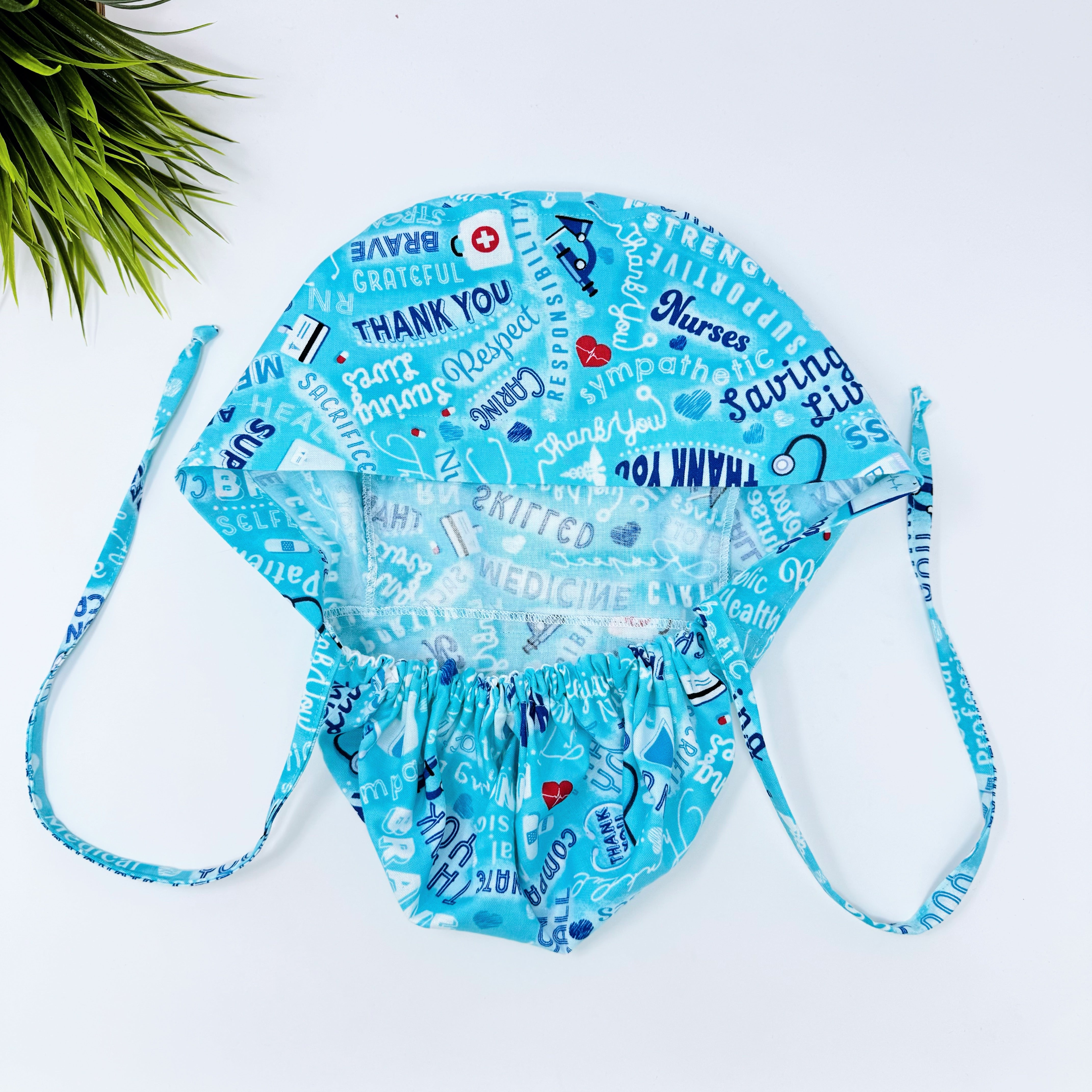 Medical Heroes Ponytail scrub cap for women with satin lined option by Paradise Caps.