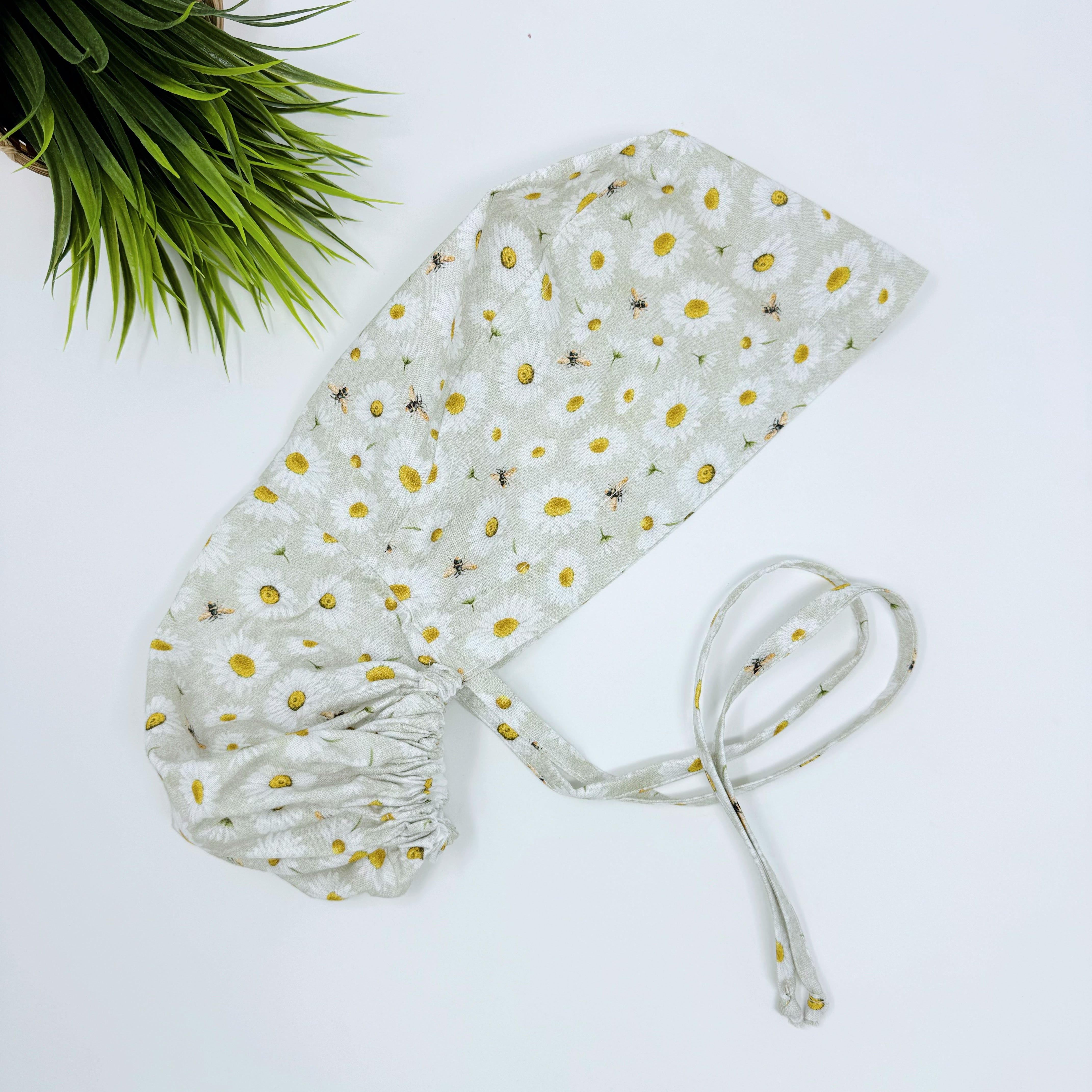 Bee And Daisy Ponytail scrub cap for women with satin lined option by Paradise Caps.