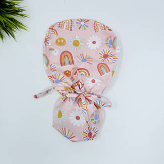 Rainbows Ponytail scrub cap for women with satin lined option by Paradise Caps.