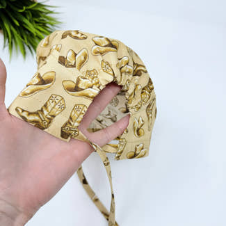 Cowboys Skull tie-back style surgical scrub cap for men by Paradise Caps.