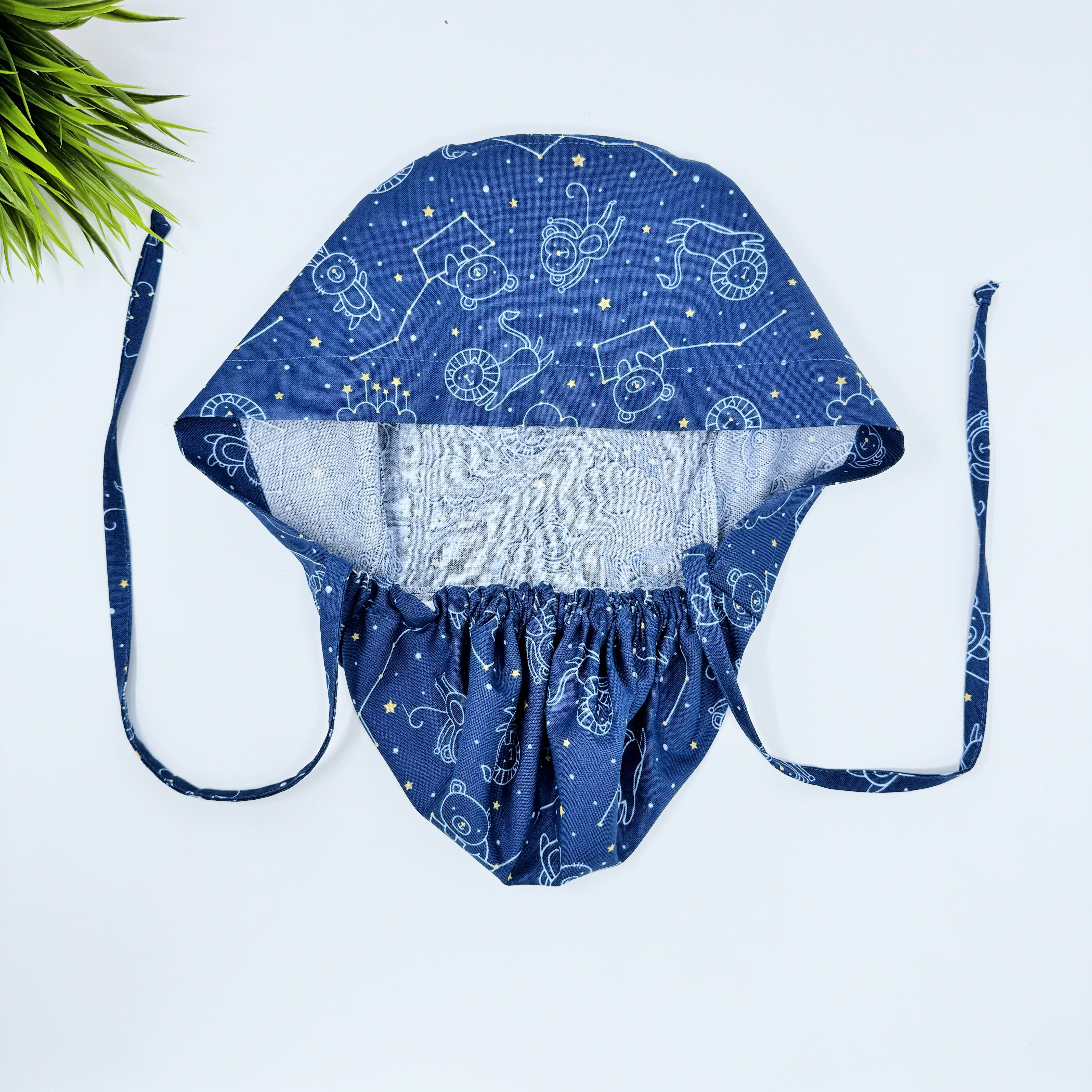 Navy Constellations Ponytail scrub cap for women with satin lined option by Paradise Caps.