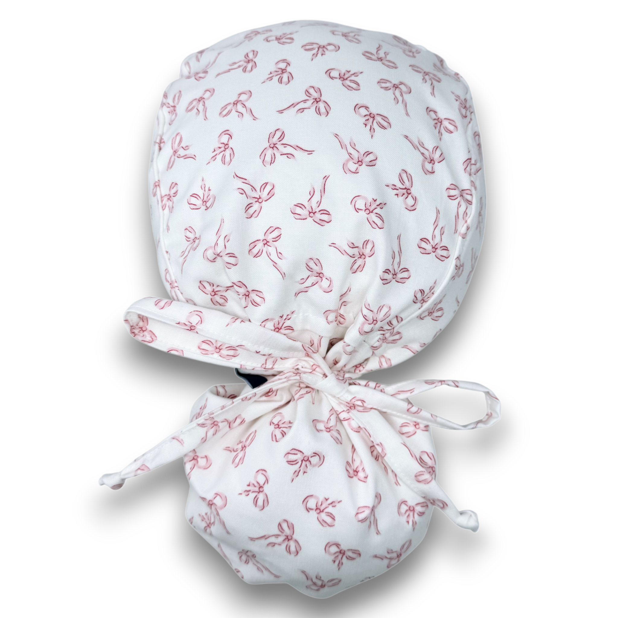 Pink Bows Ponytail scrub cap with satin lined. Bow Print surgical cap for women by Paradise Caps.