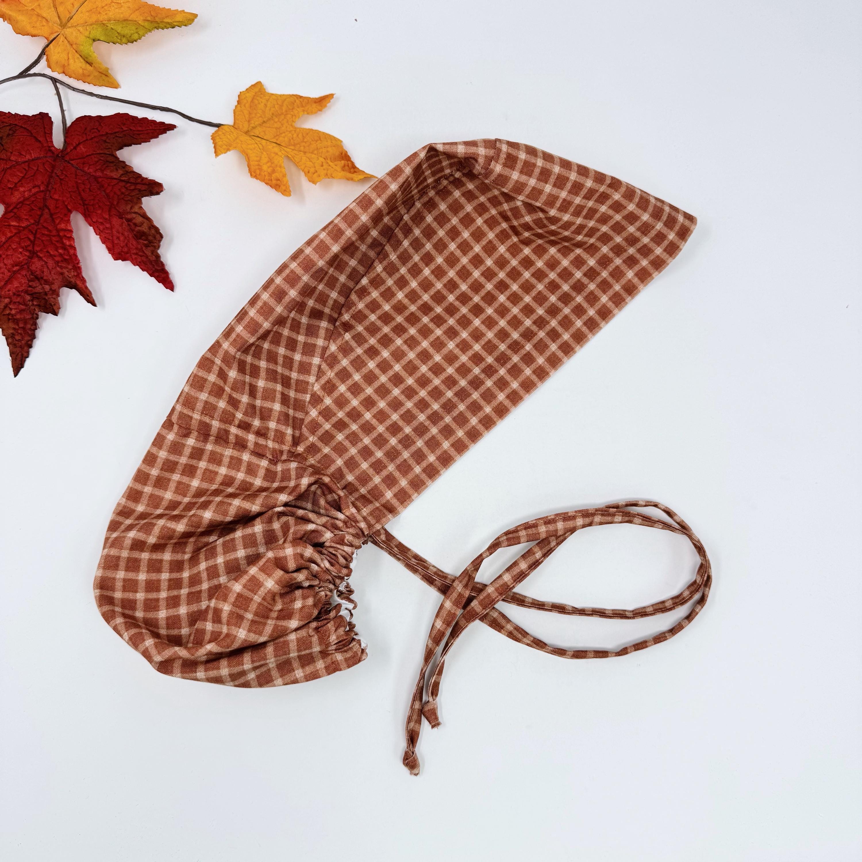 Rustic Check Ponytail scrub cap for women. Rust Surgical cap with ponytail, satin lined option by Paradise Caps.