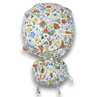 Ponytail scrub cap for women. Easter surgical cap with ponytail with satin lined option by Paradise Caps.