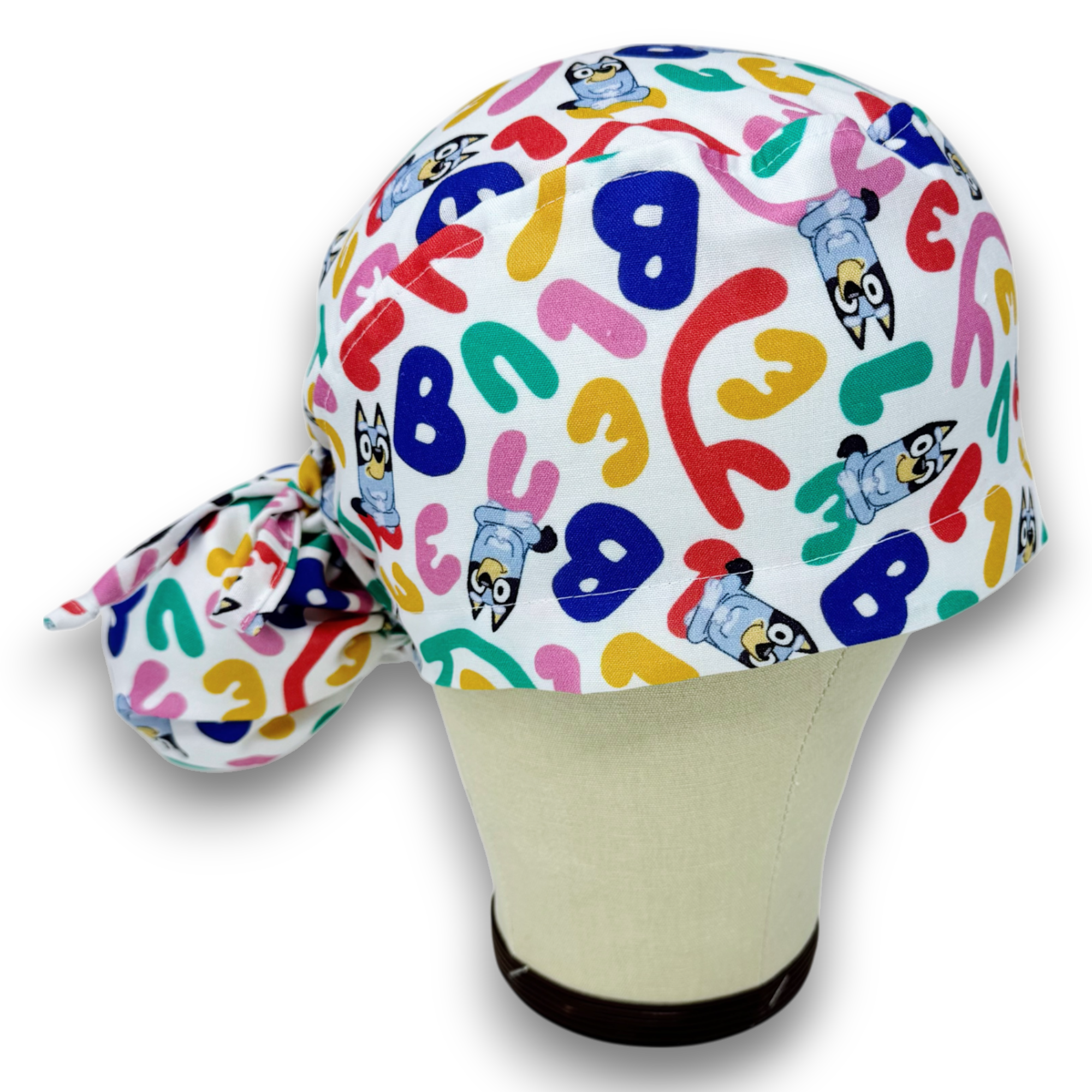 Funny Ponytail scrub cap for women with satin lined option by Paradise Caps.
