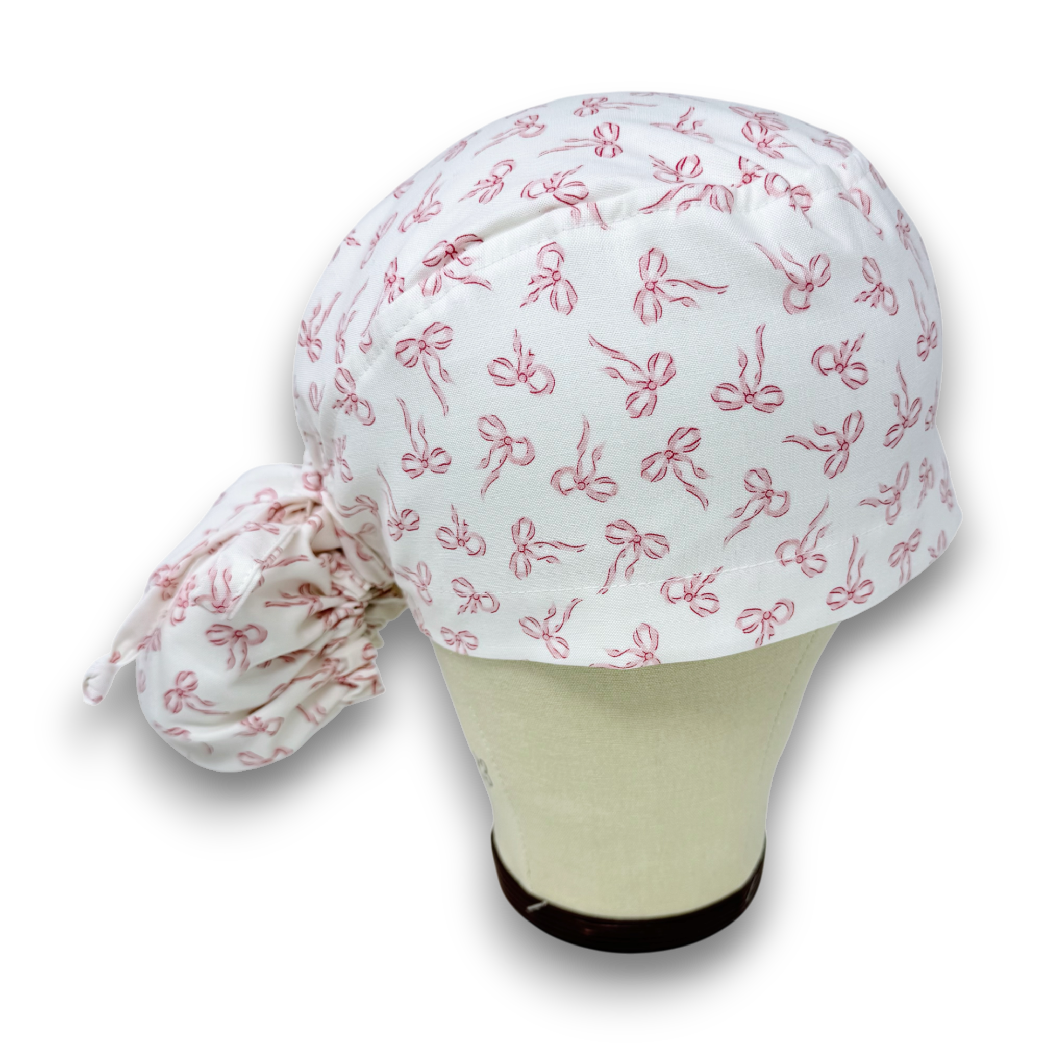 Pink Bows Ponytail scrub cap with satin lined. Bow Print surgical cap for women by Paradise Caps.