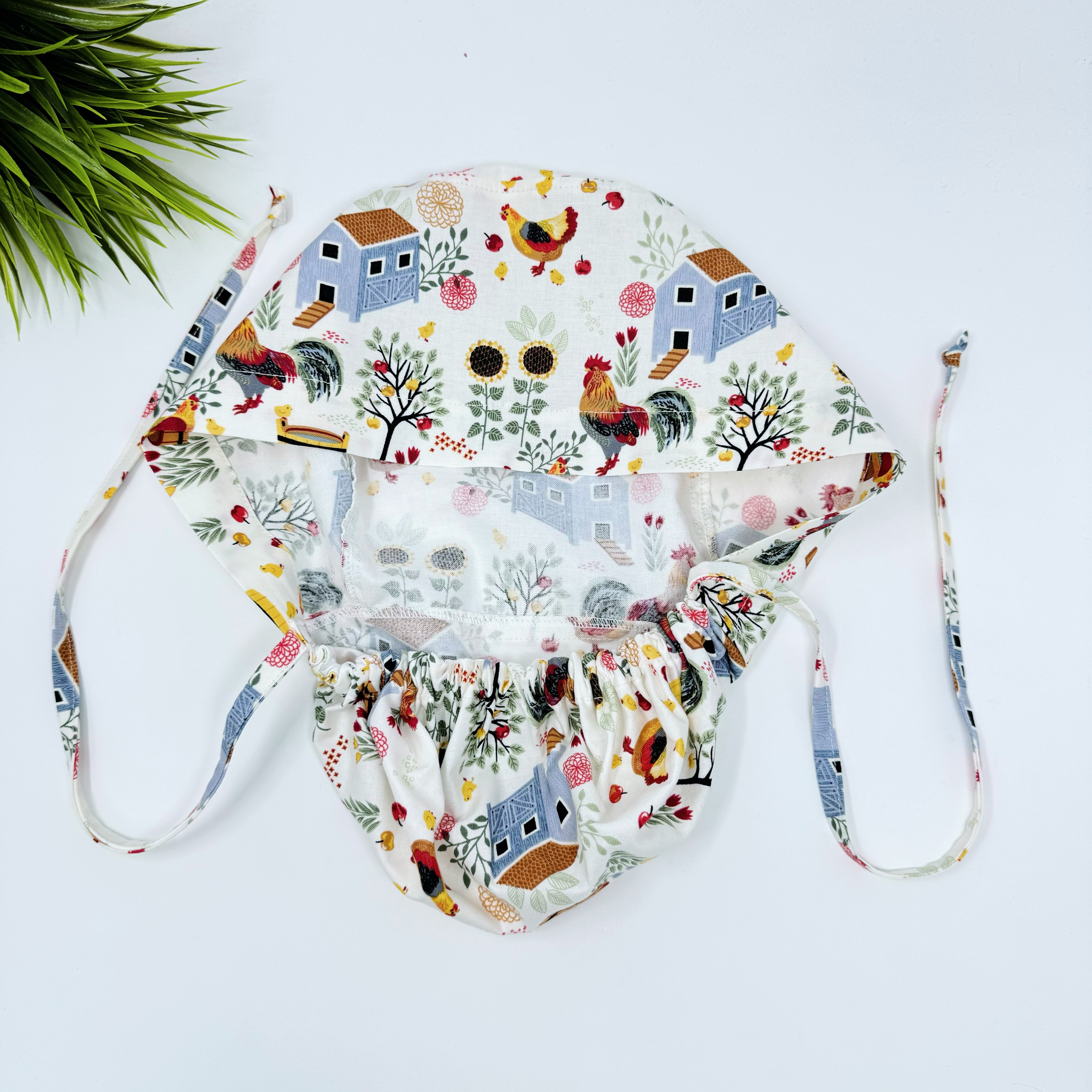 Chicken & Coop Ponytail scrub cap for women with satin lined option by Paradise Caps.