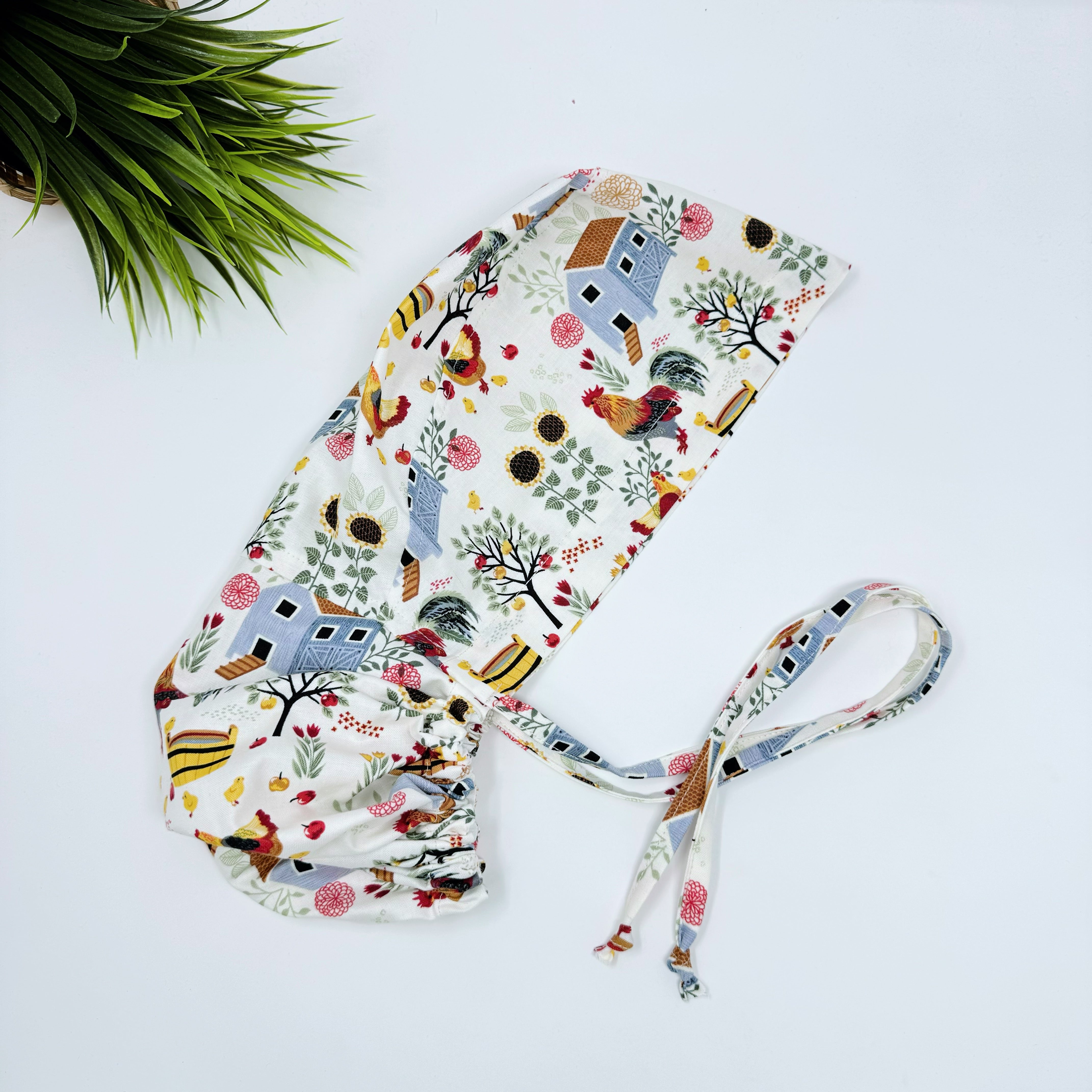 Chicken & Coop Ponytail scrub cap for women with satin lined option by Paradise Caps.