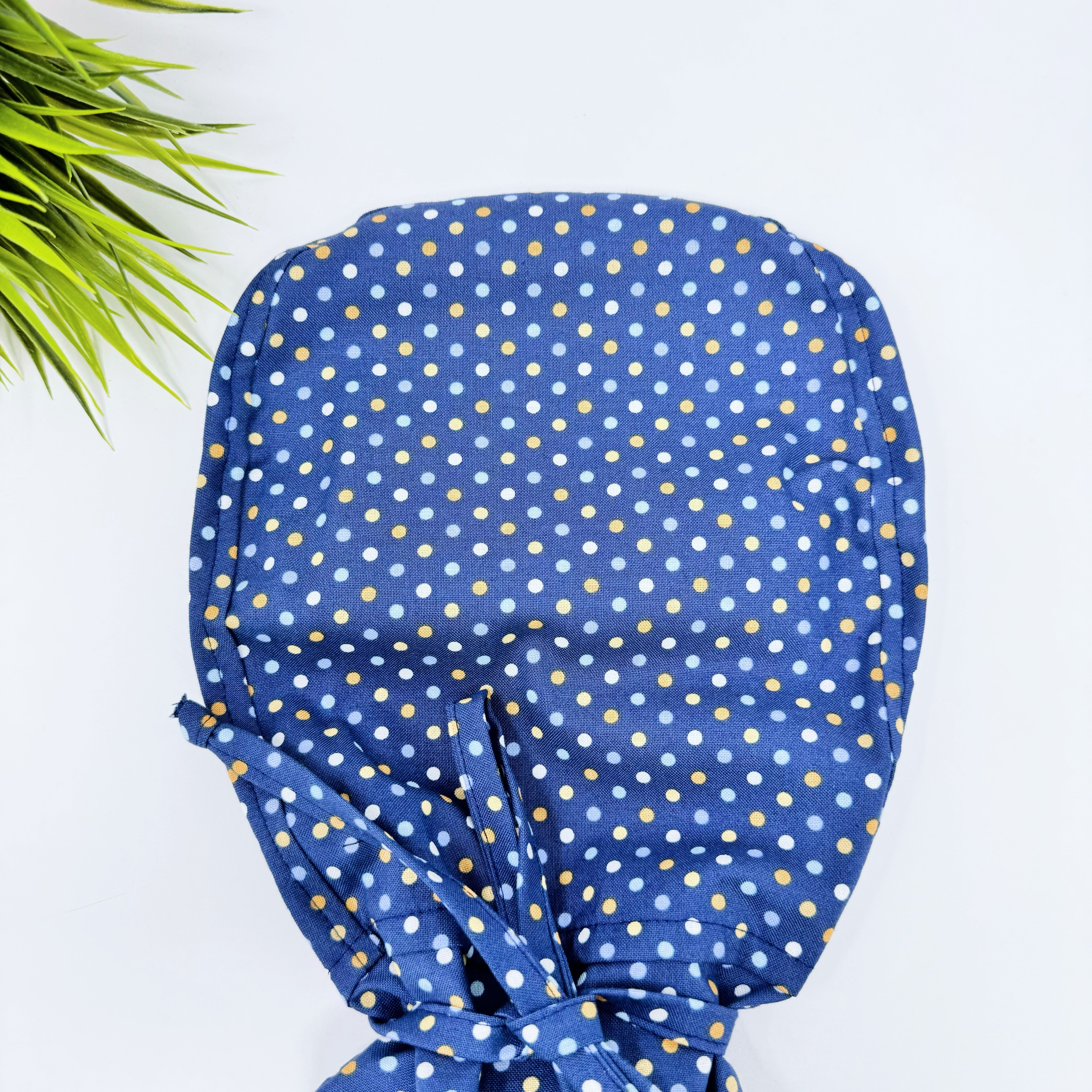 Navy Polka Dot Ponytail scrub cap for women with satin lined option by Paradise Caps.