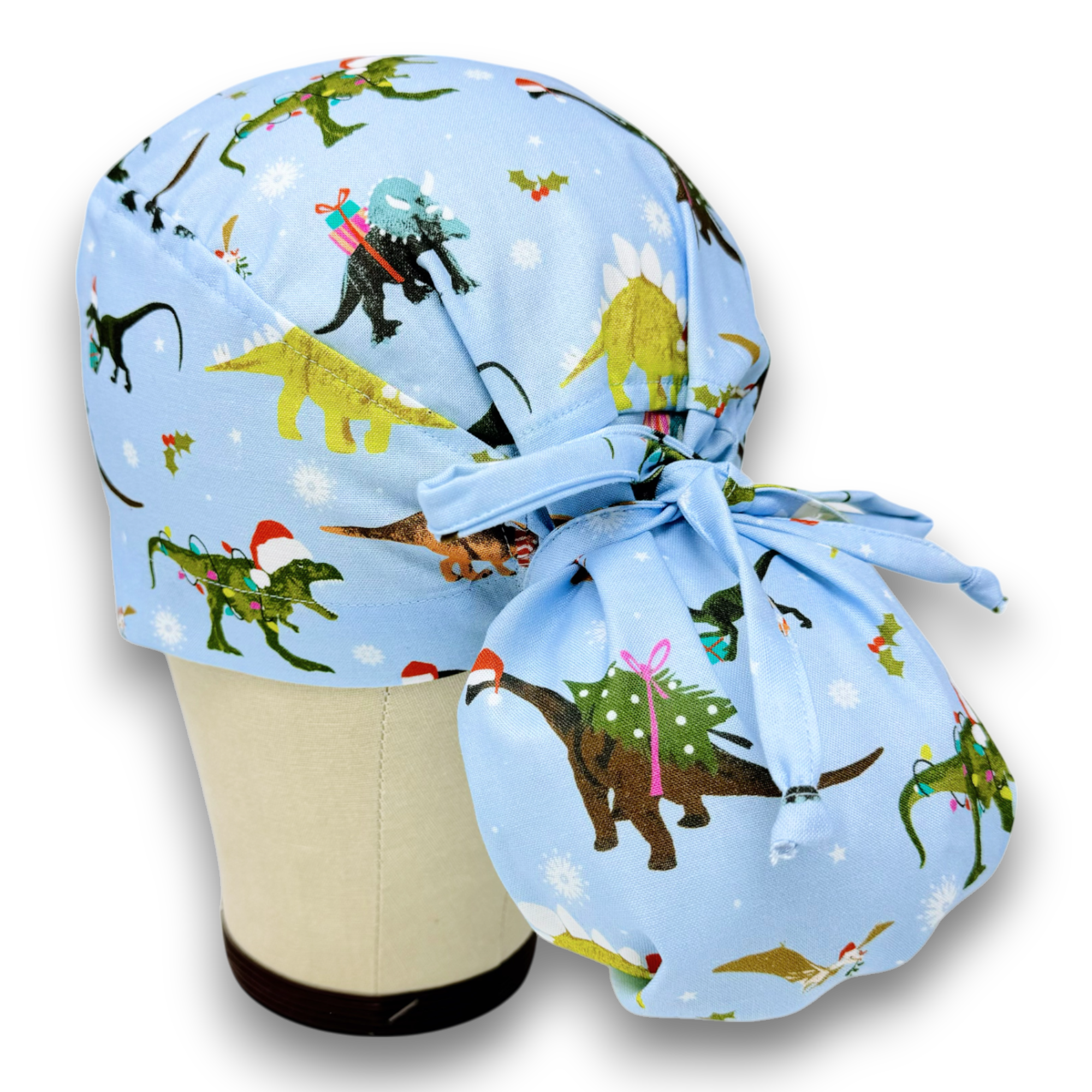 Christmas Dino Ponytail scrub cap for women with satin lined option by Paradise Caps.
