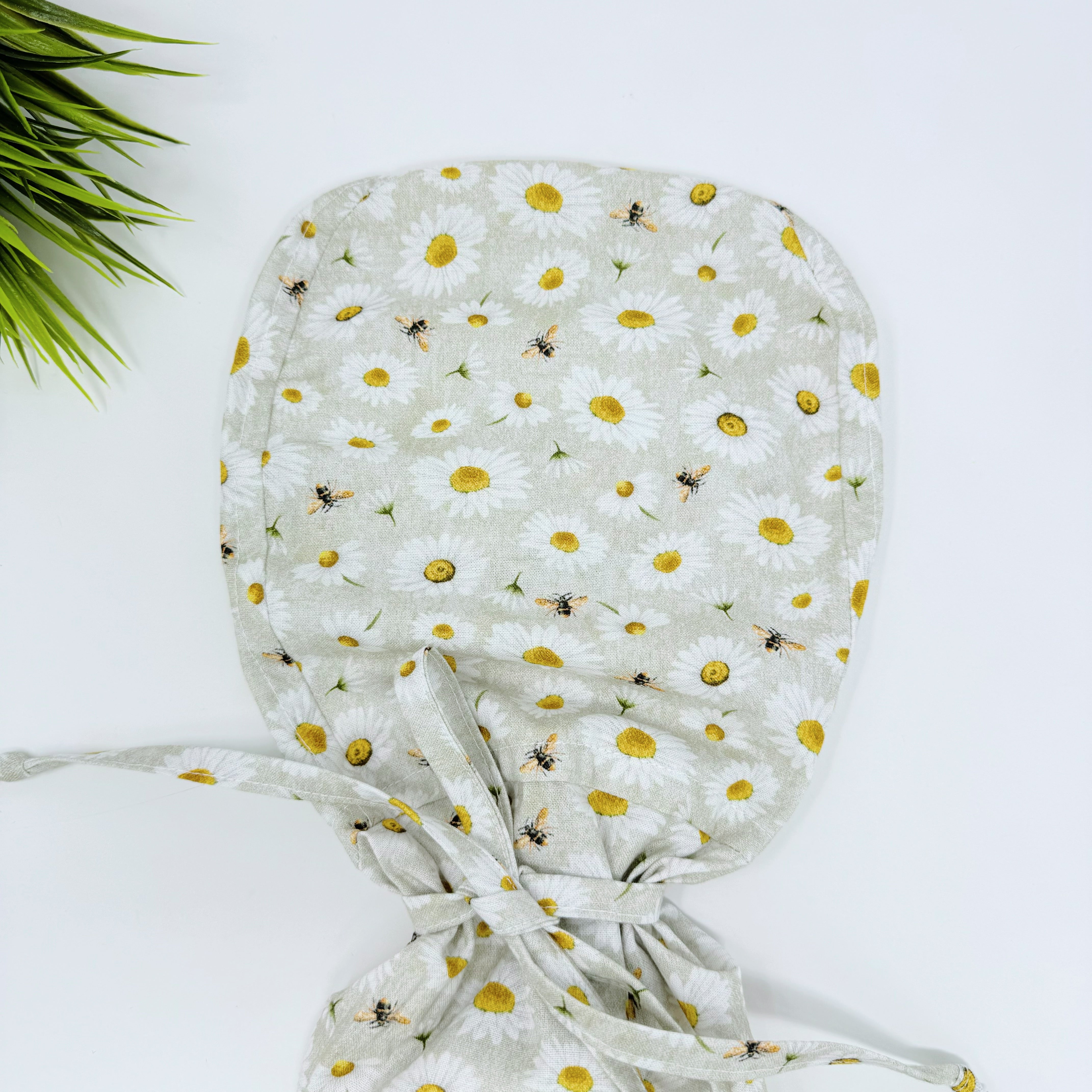 Bee And Daisy Ponytail scrub cap for women with satin lined option by Paradise Caps.