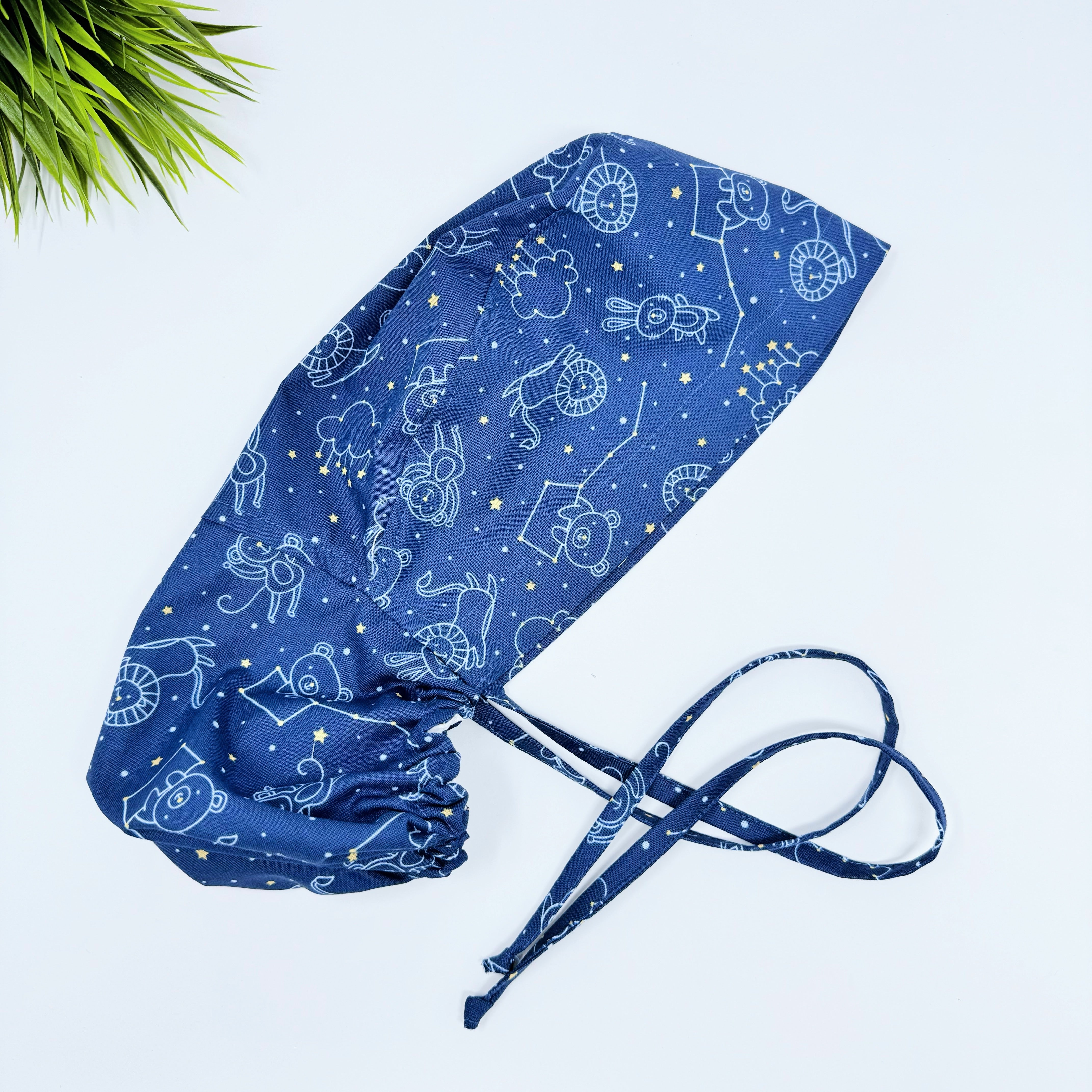 Navy Constellations Ponytail scrub cap for women with satin lined option by Paradise Caps.