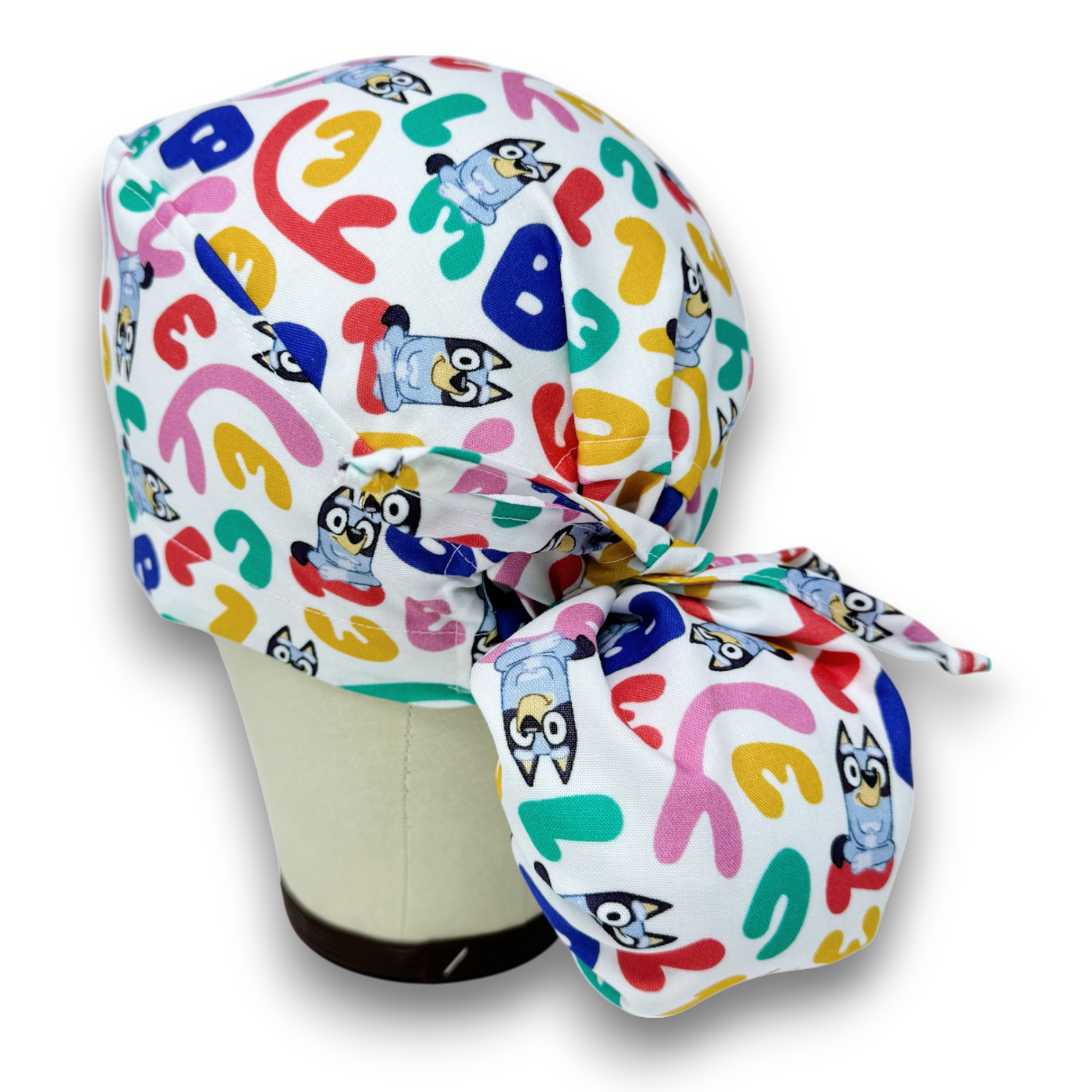 Funny Ponytail scrub cap for women with satin lined option by Paradise Caps.