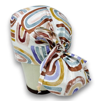 Rainbow Ponytail scrub cap for women with satin lined option by Paradise Caps.
