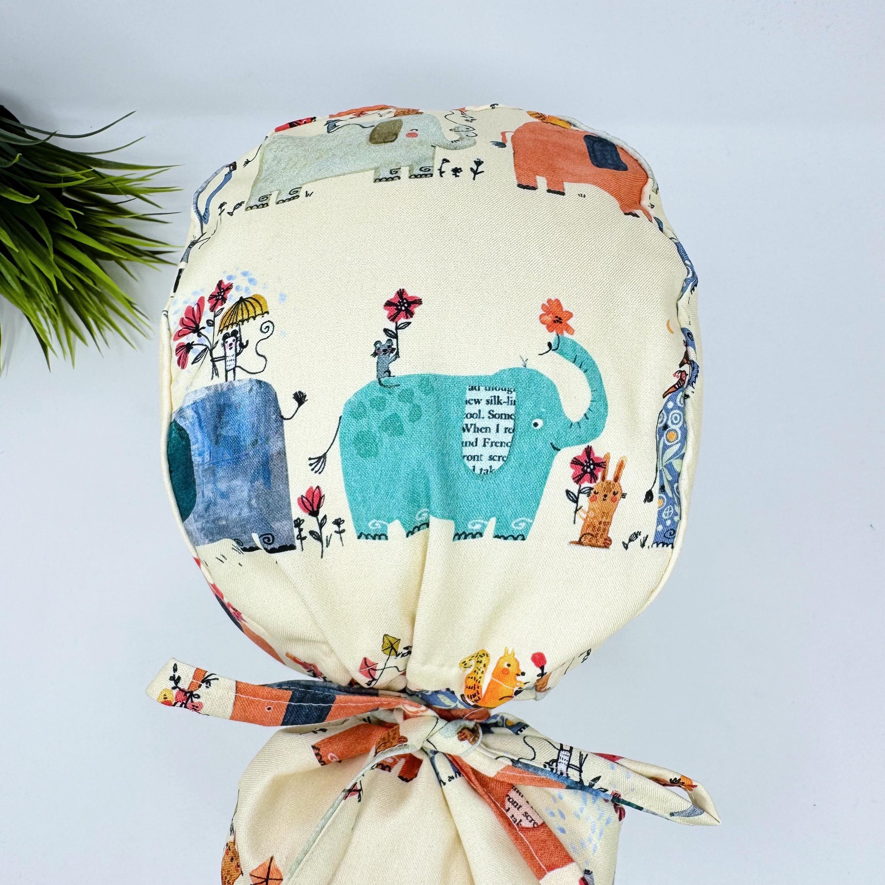 Elephant Ponytail scrub cap for women. Jungle Surgical hat with satin lined option by Paradise Caps.