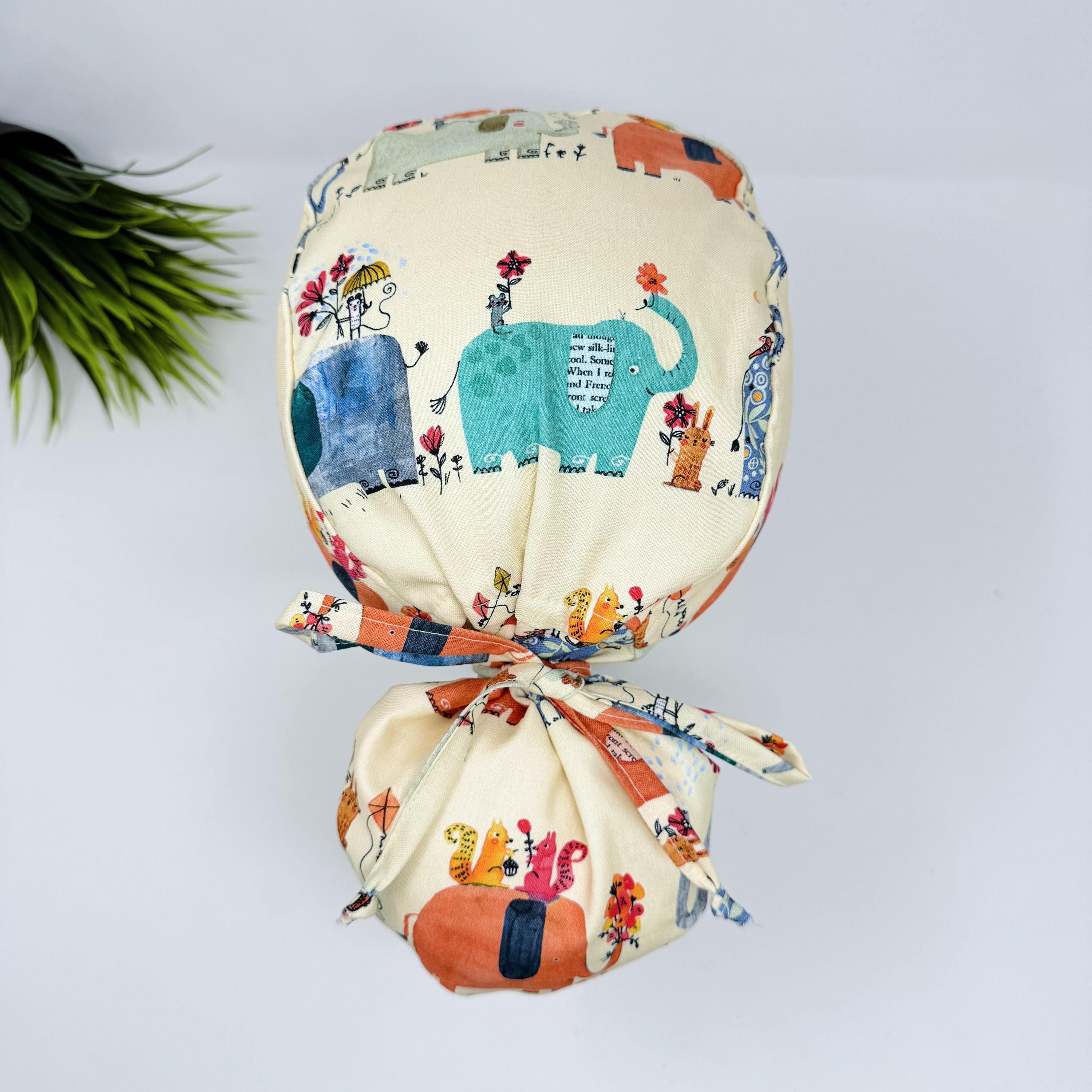Elephant Ponytail scrub cap for women. Jungle Surgical hat with satin lined option by Paradise Caps.