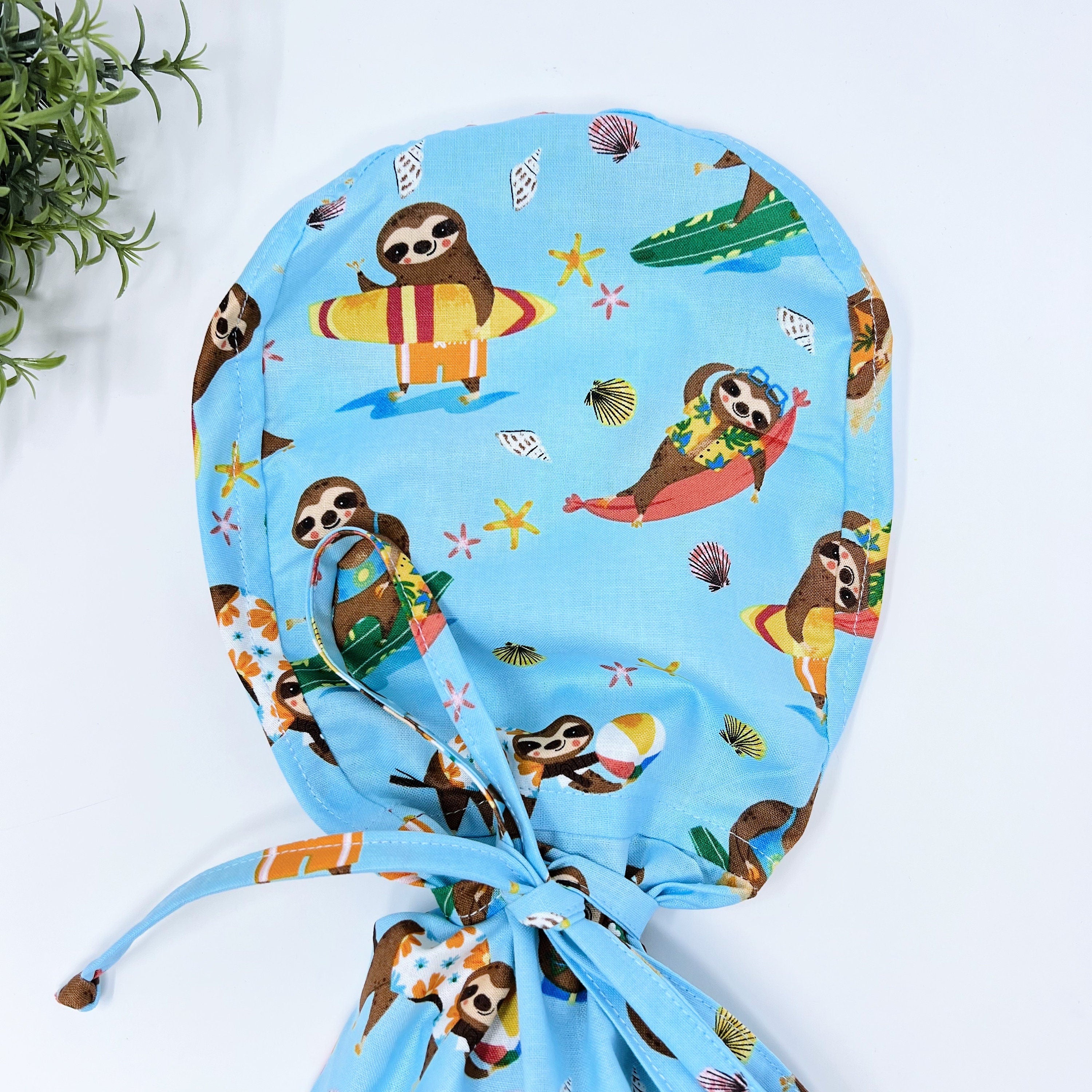 Sloth Ponytail scrub cap for women with satin lined option by Paradise Caps.
