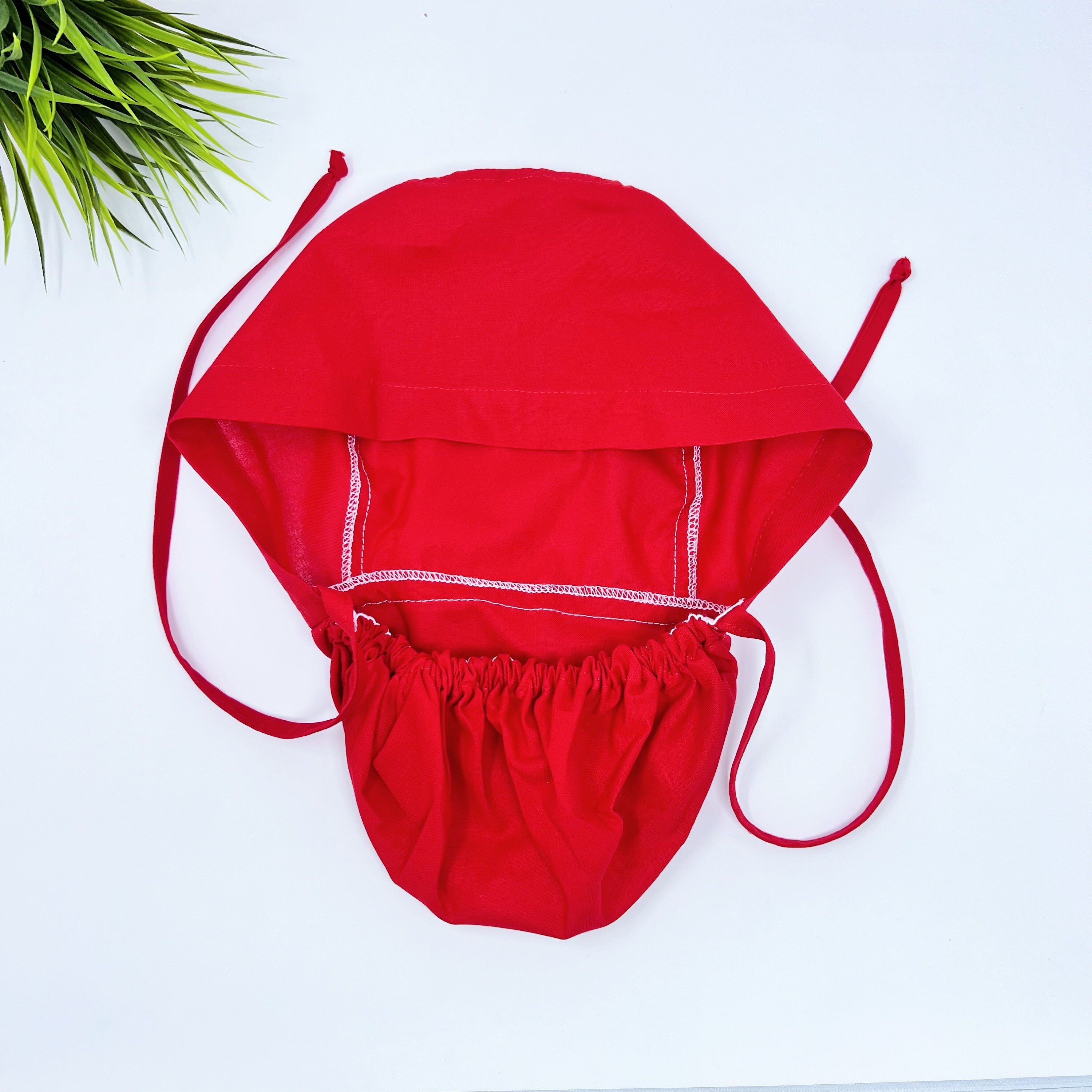 Solid red Ponytail scrub cap for women with satin lined option by Paradise Caps.