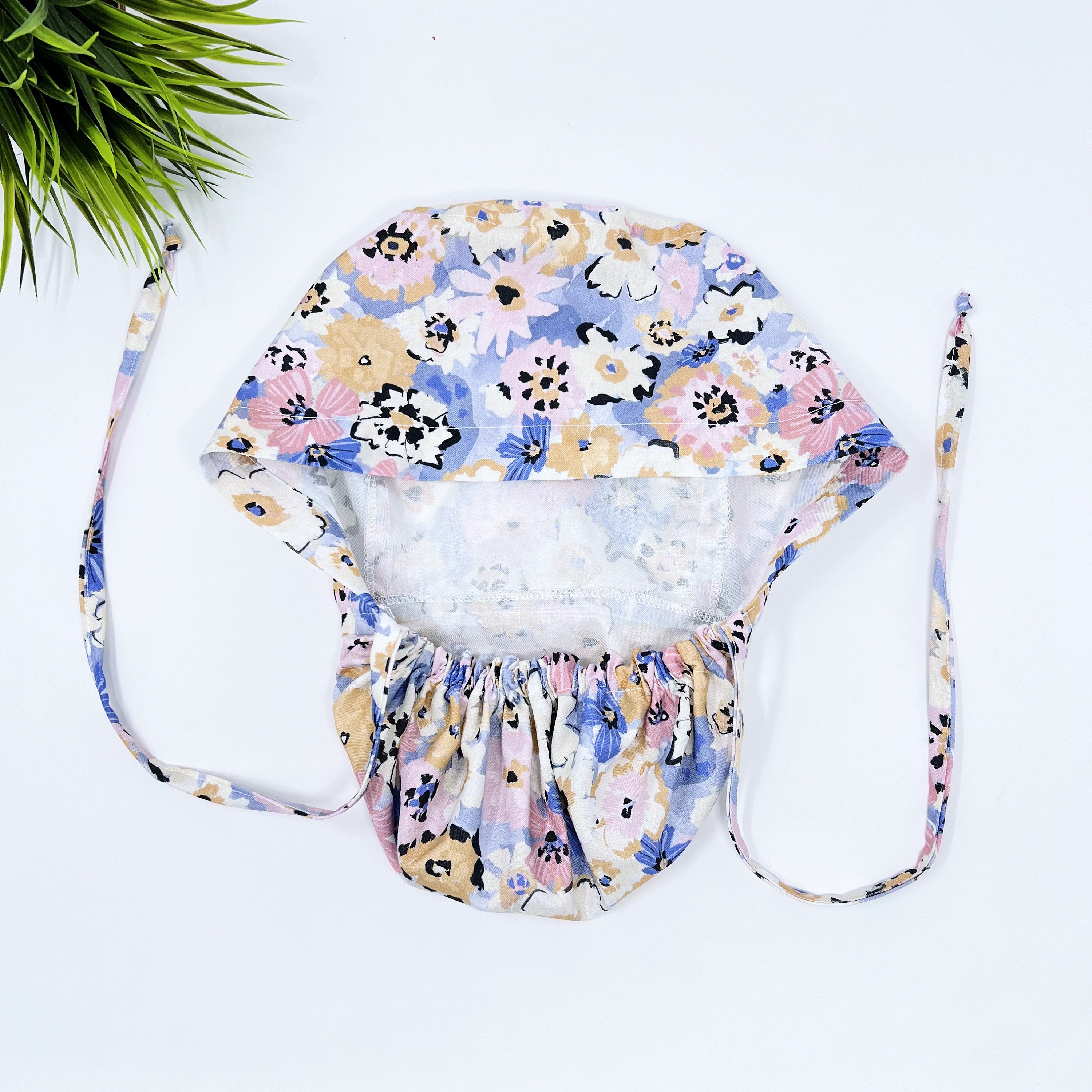 Multi Fleurs Ponytail scrub cap for women with satin lined option by Paradise Caps.