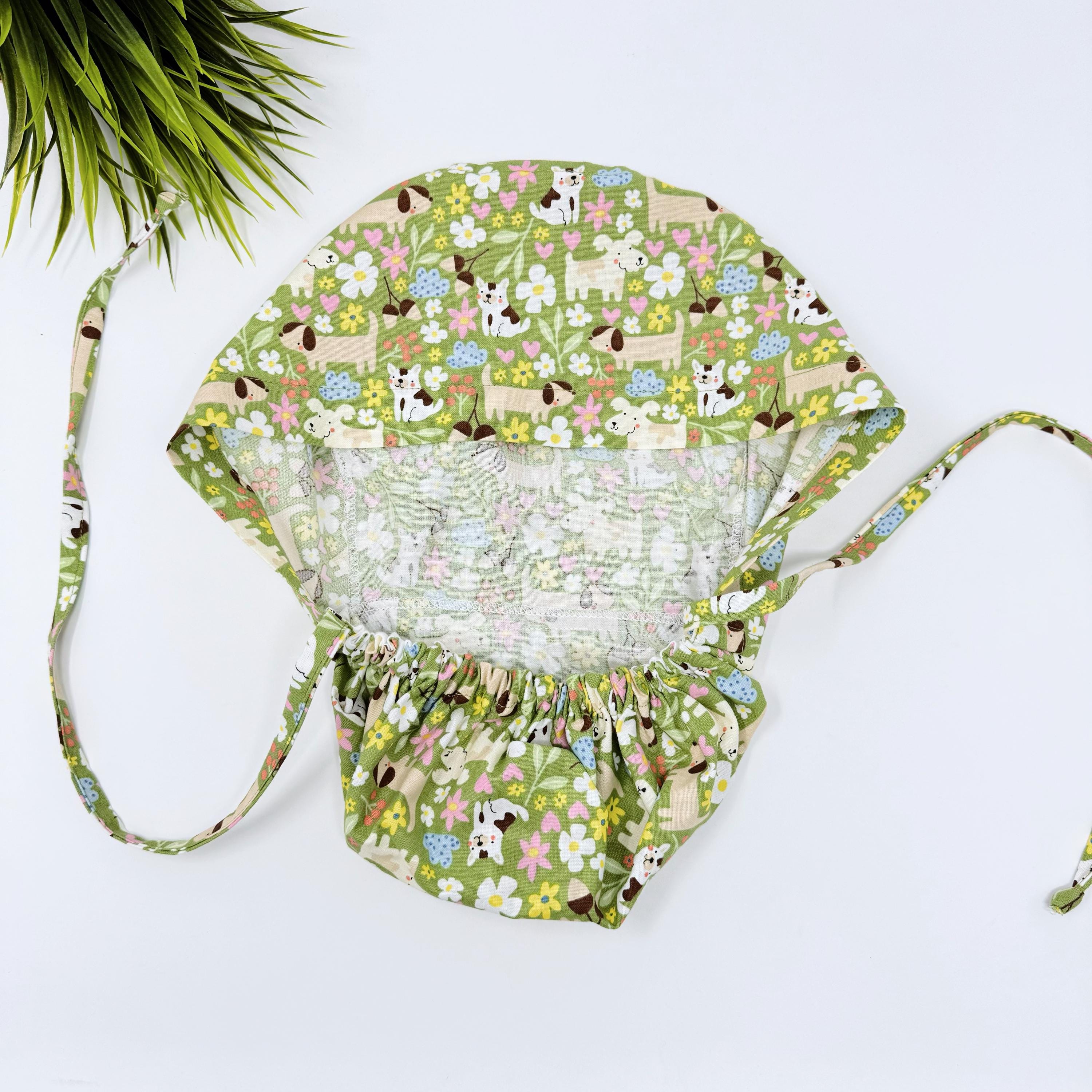 Dog Ponytail scrub cap with satin lined option. Summer surgical hat for women by Paradise Caps. Dogs & Florals - print.