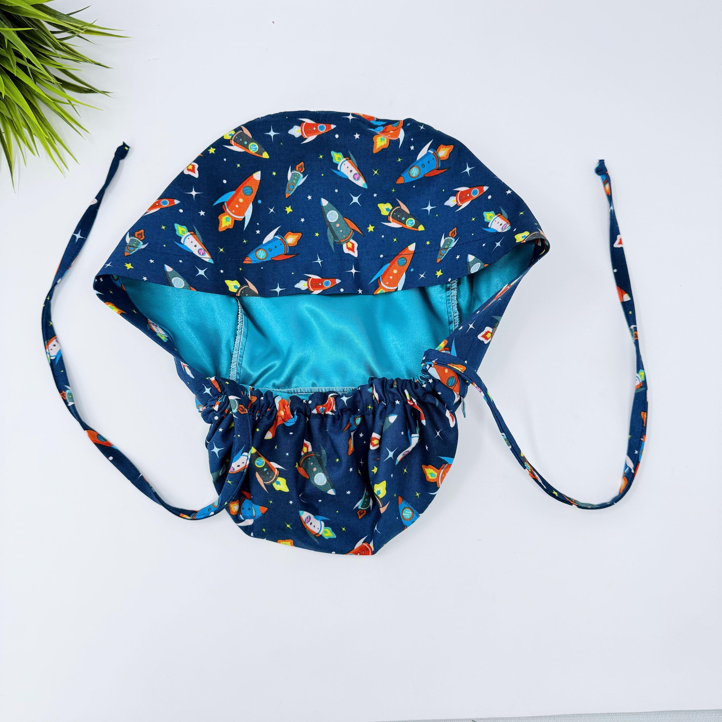 Rocket Ponytail scrub cap for women with satin lined option by Paradise Caps.