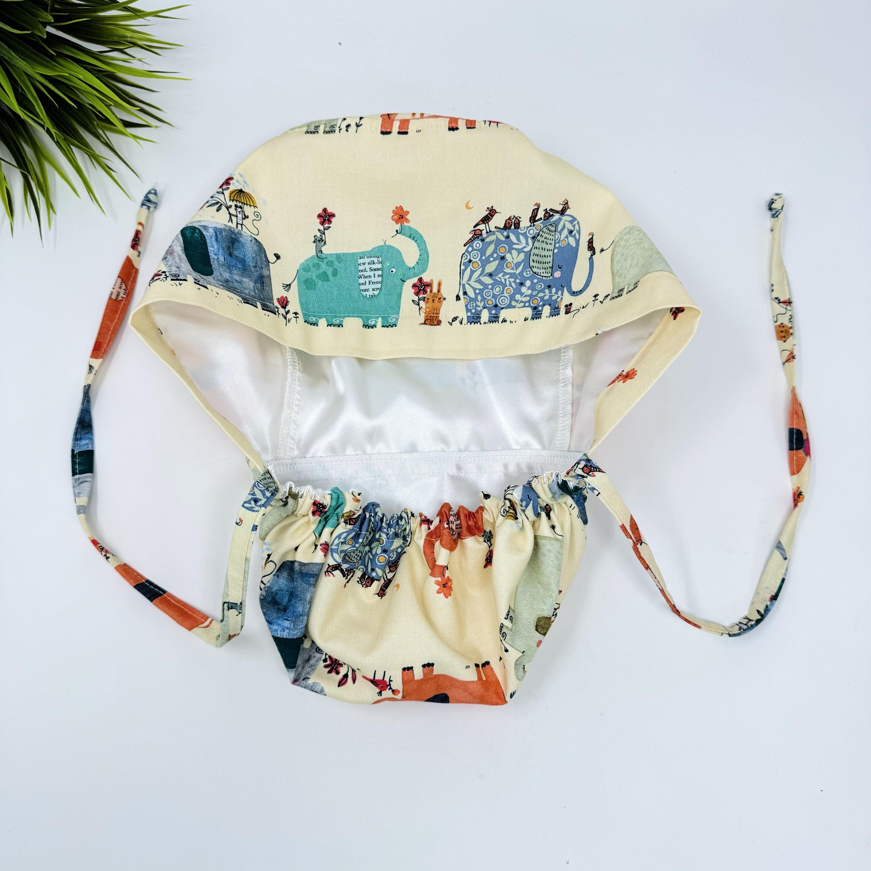 Elephant Ponytail scrub cap for women. Jungle Surgical hat with satin lined option by Paradise Caps.