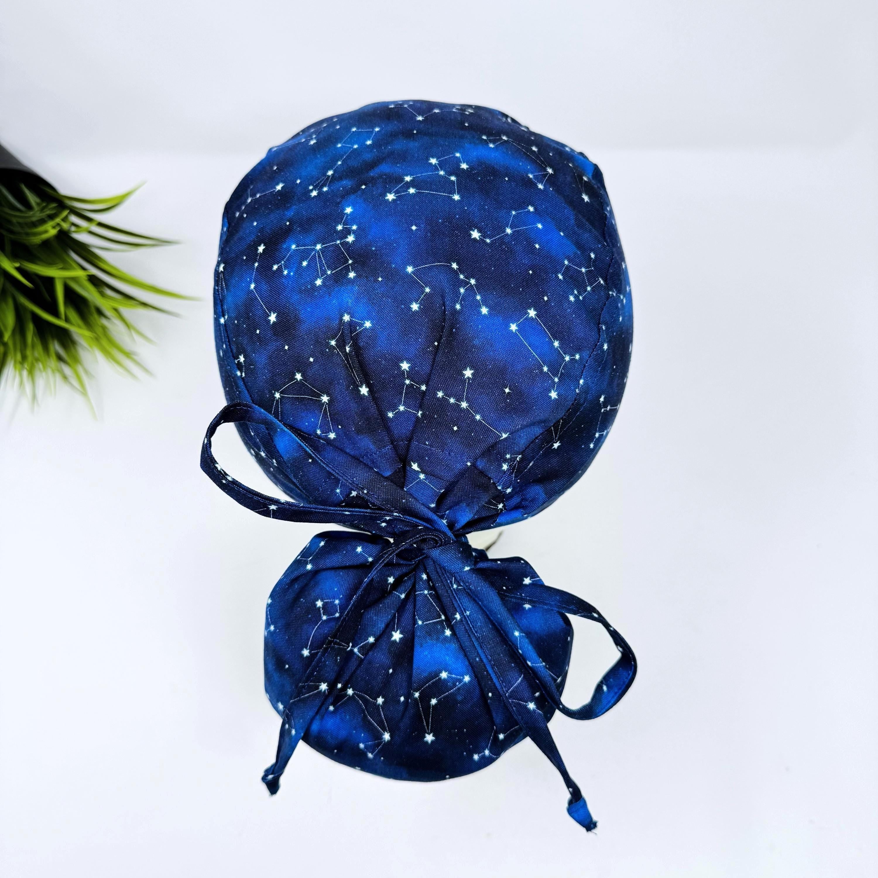 Ponytail scrub cap with satin lined option. Constellation Blue Scrub hat for women by Paradise Caps.