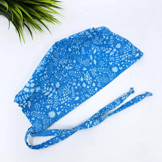 Calm Blue Floral Skull tie-back style surgical scrub cap by Paradise Caps.