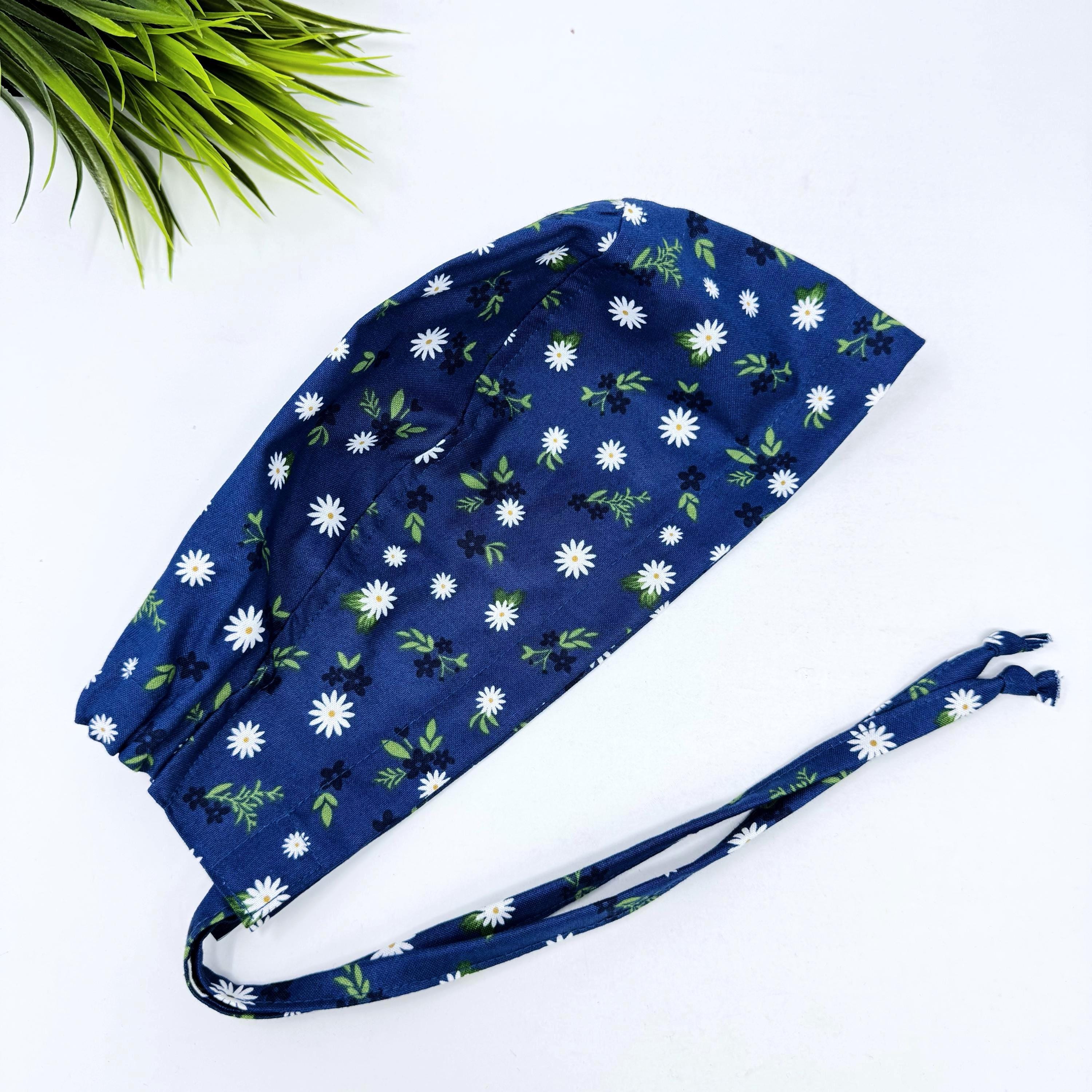 Navy Daisy Skull tie-back style surgical scrub cap by Paradise Caps.