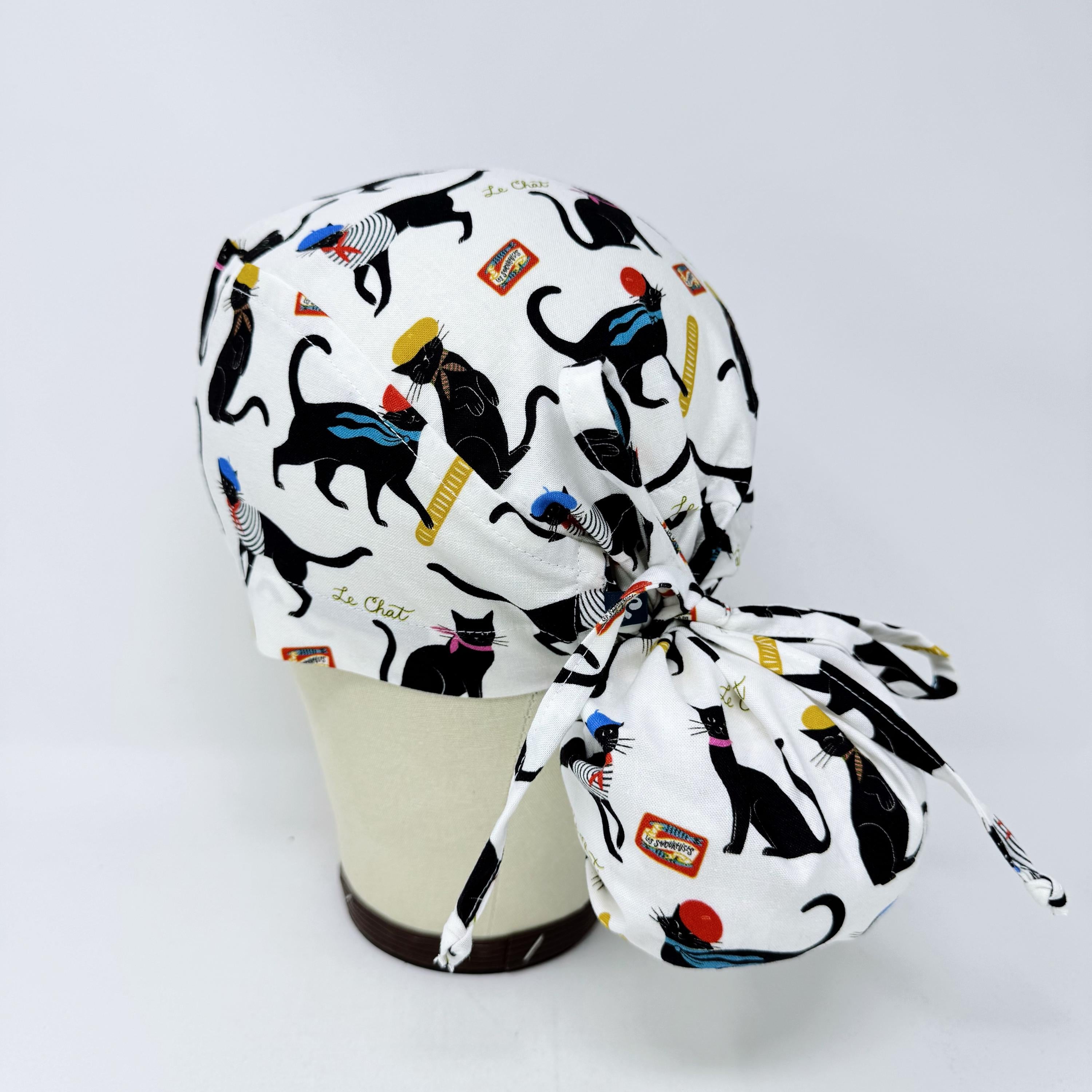 Ponytail scrub cap by Paradise Caps. Parisian Cat Surgical hat for women with satin lined option.