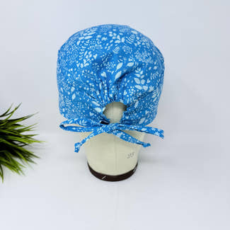 Calm Blue Floral Skull tie-back style surgical scrub cap by Paradise Caps.