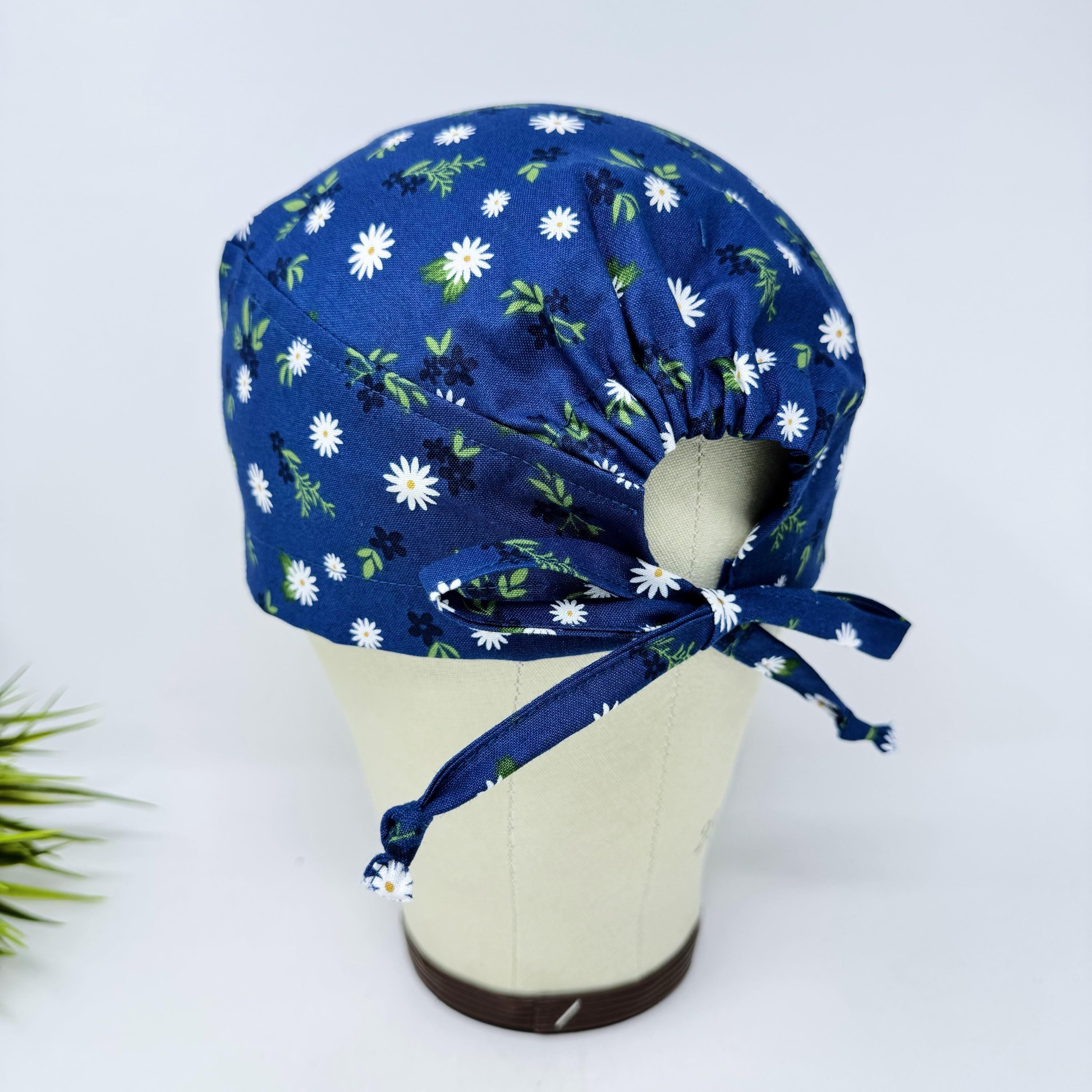 Navy Daisy Skull tie-back style surgical scrub cap by Paradise Caps.