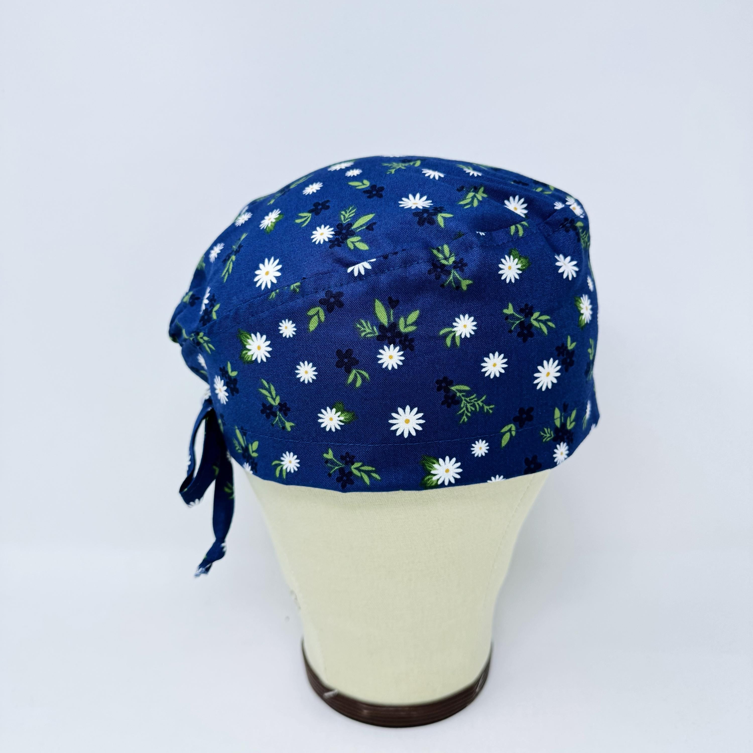 Navy Daisy Skull tie-back style surgical scrub cap by Paradise Caps.