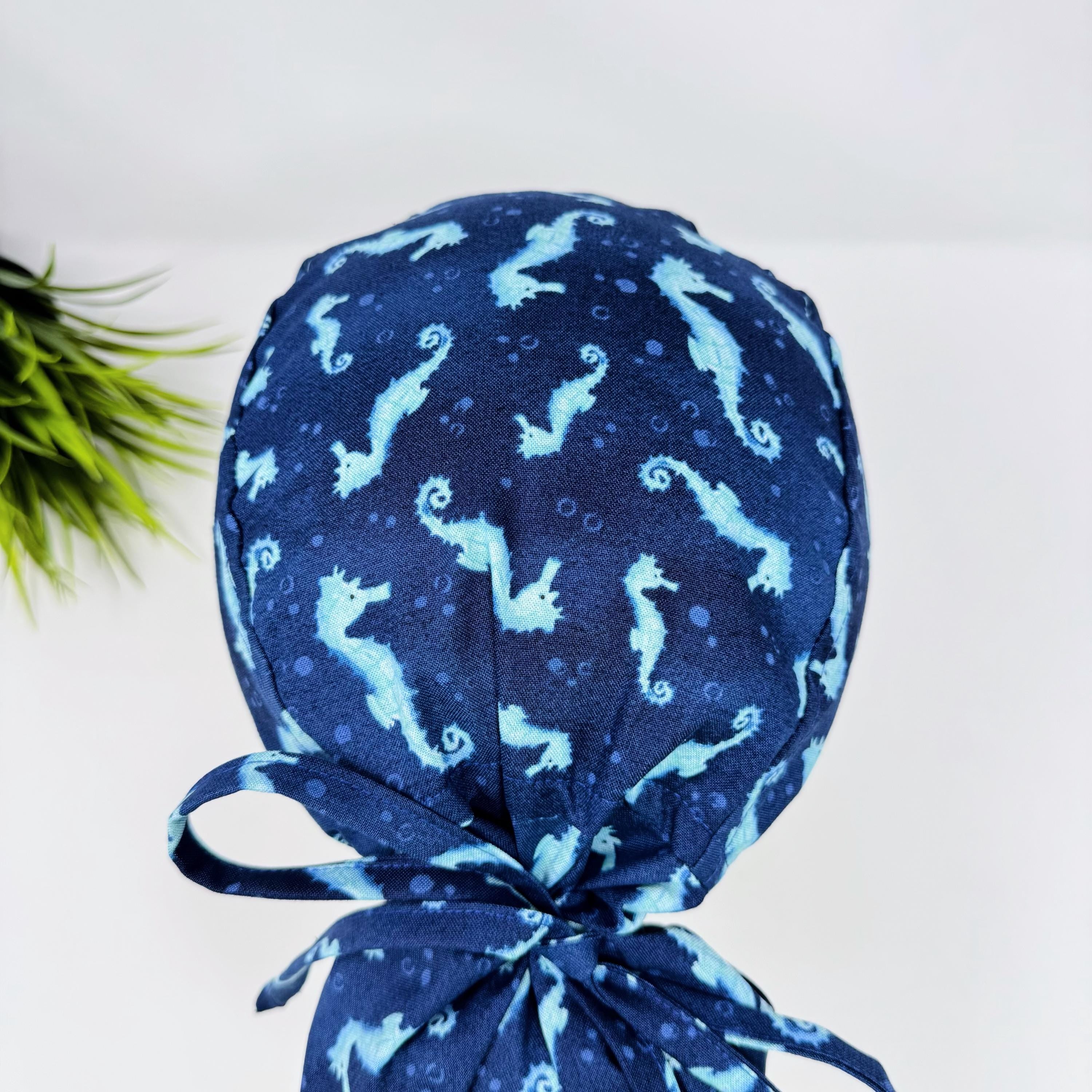 Ponytail scrub cap women. Ocean Seahorse Print Satin Lined option Ponytail scrub hat. Scrub caps for women by Paradise Caps.