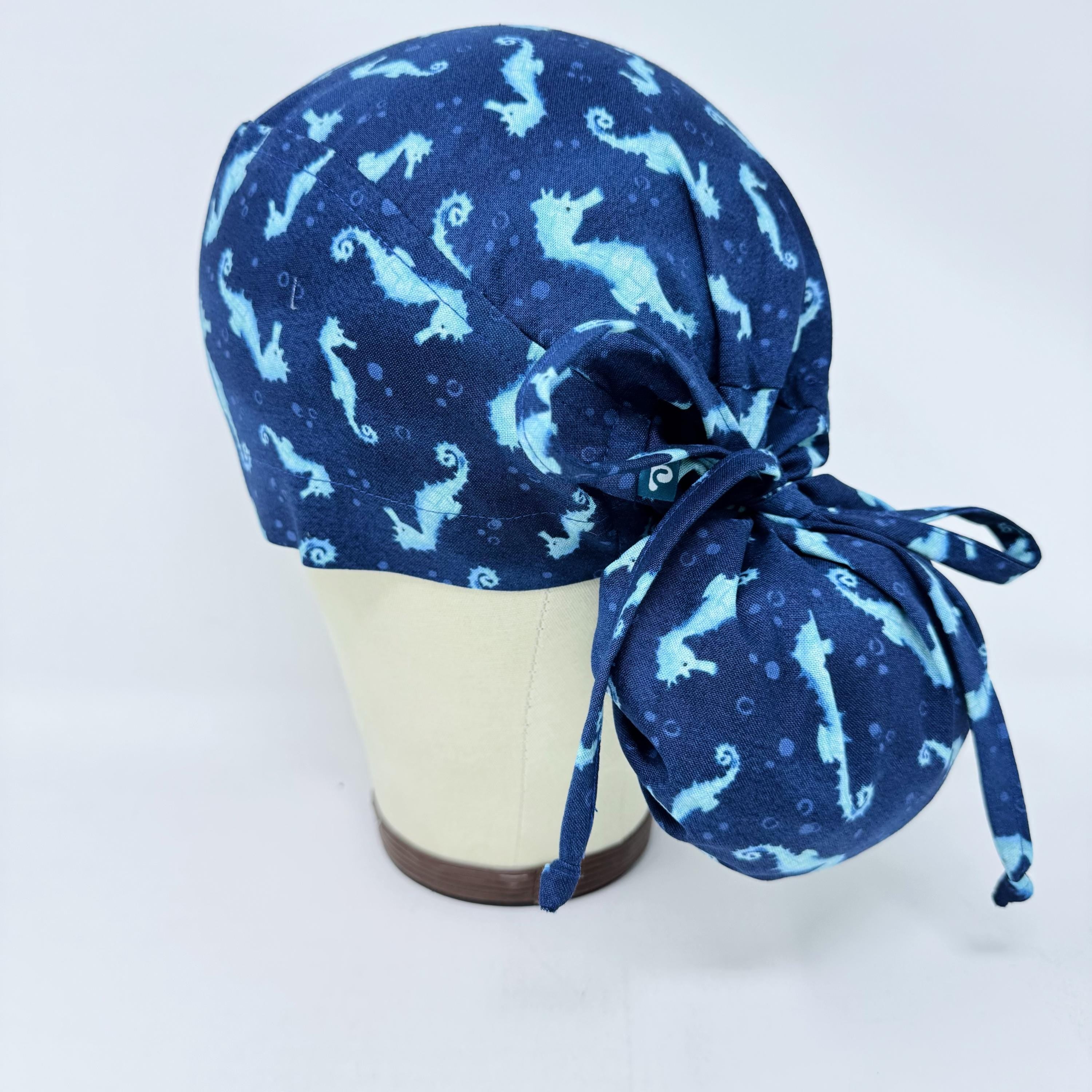 Ponytail scrub cap women. Ocean Seahorse Print Satin Lined option Ponytail scrub hat. Scrub caps for women by Paradise Caps.