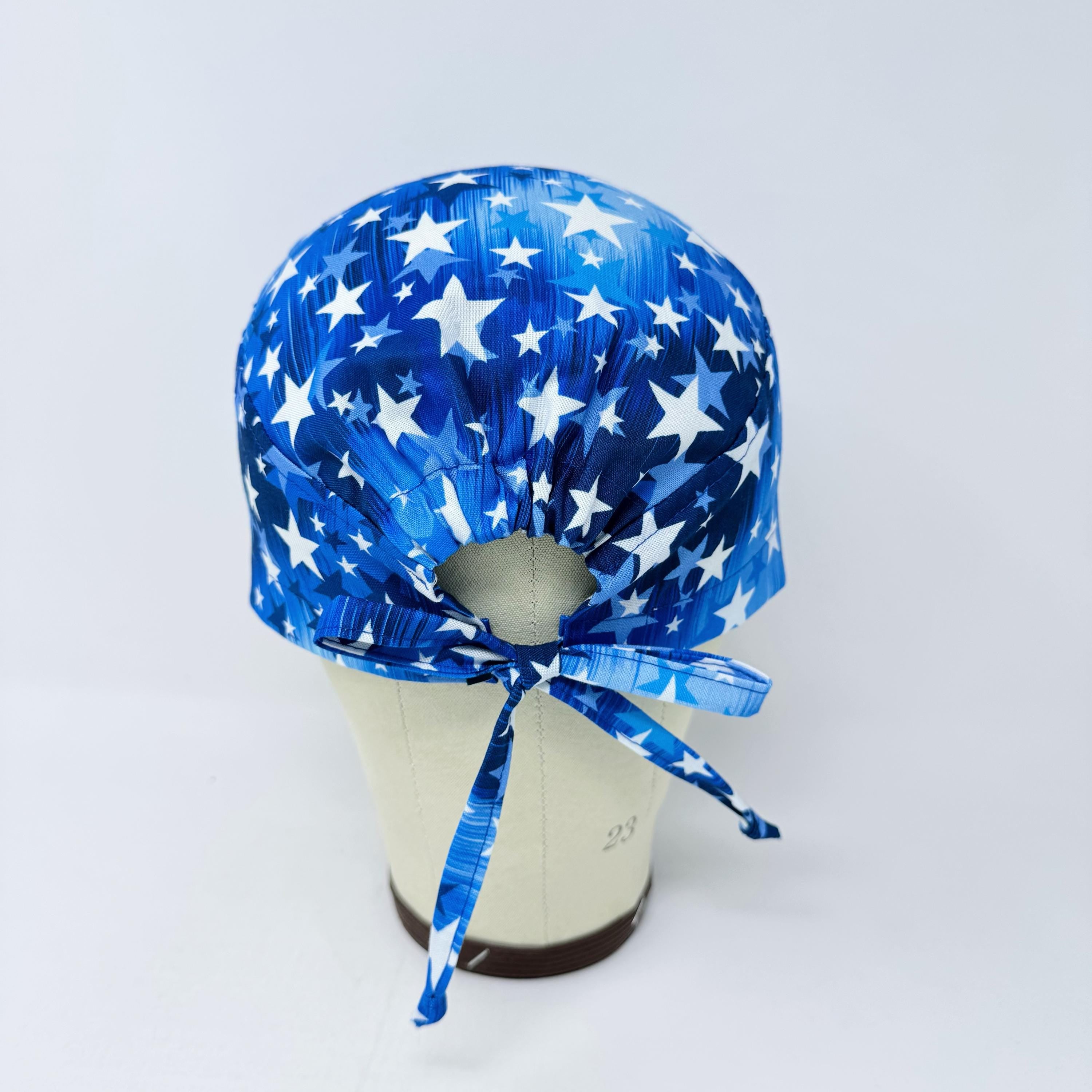 Surgical scrub cap for men. Blue Star tie back scrub hat with satin lined by Paradise Caps.
