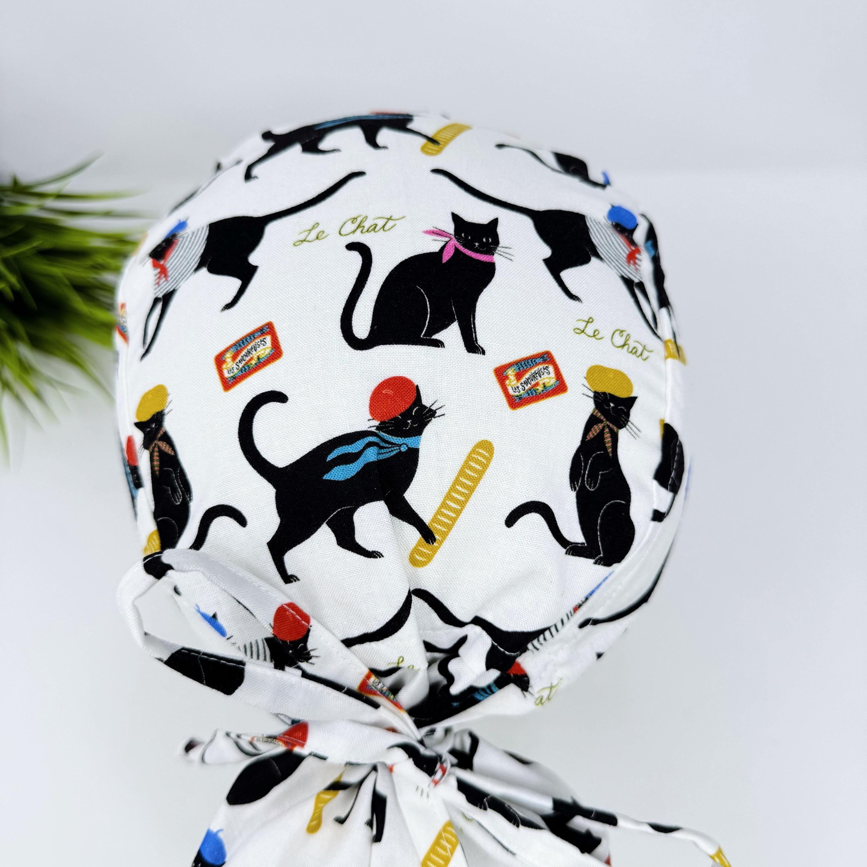 Ponytail scrub cap by Paradise Caps. Parisian Cat Surgical hat for women with satin lined option.