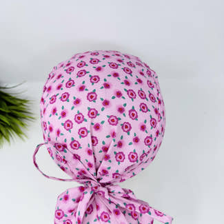 Ponytail scrub cap for women. Pink Floral Scrub hat for women with satin lined option by Paradise Caps.
