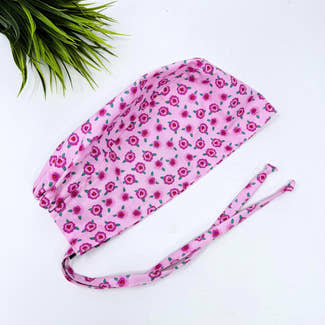 Pink Floral Skull tie-back style surgical scrub cap by Paradise Caps.
