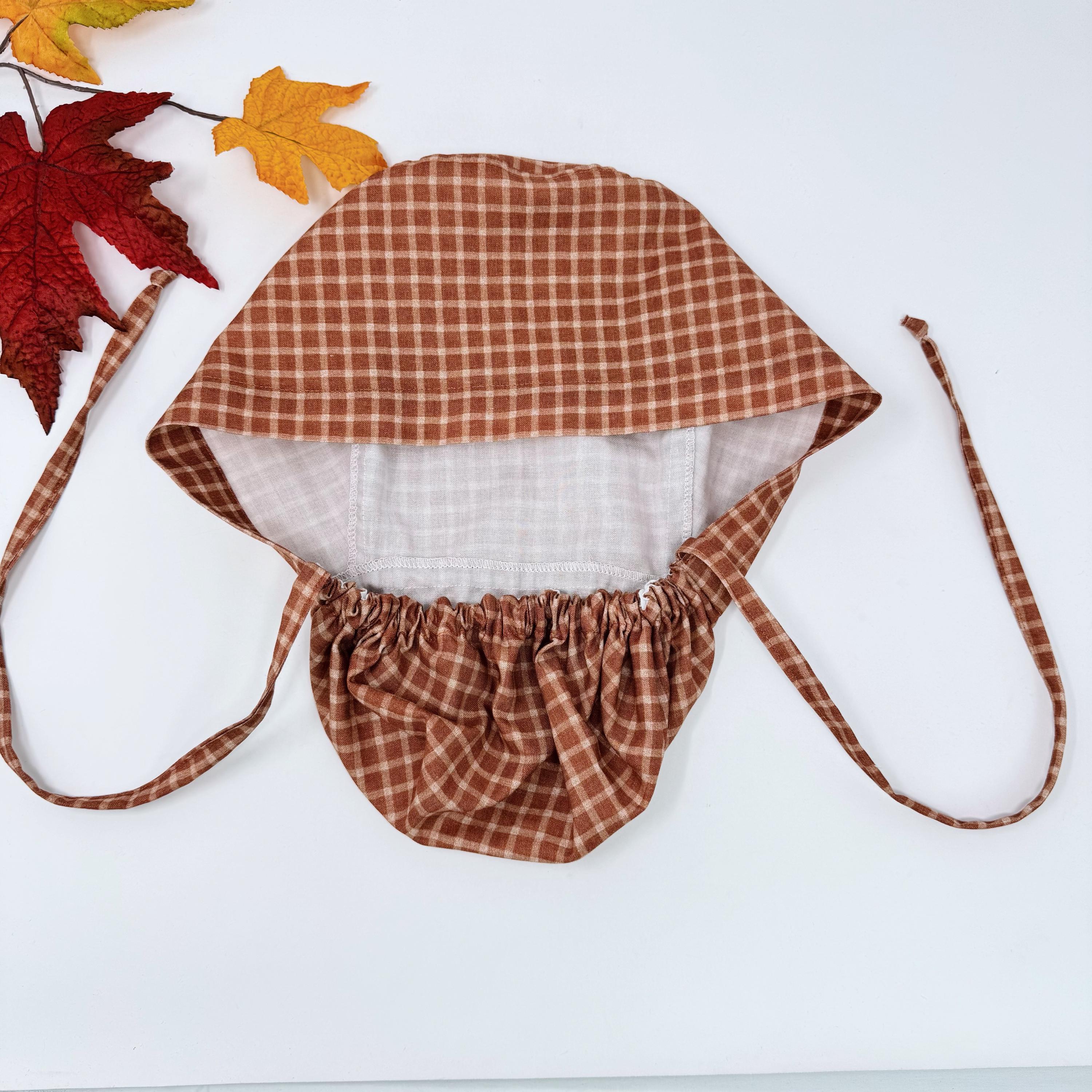 Rustic Check Ponytail scrub cap for women. Rust Surgical cap with ponytail, satin lined option by Paradise Caps.