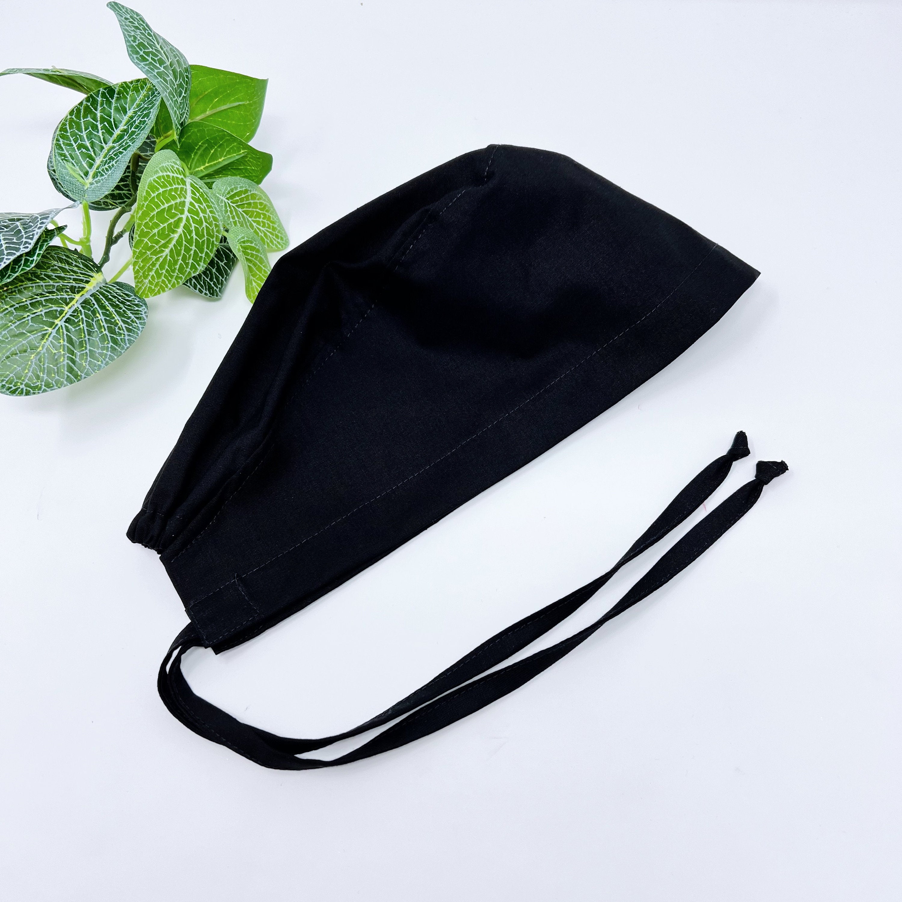 Black Skull tie-back style surgical scrub cap for men by Paradise Caps.