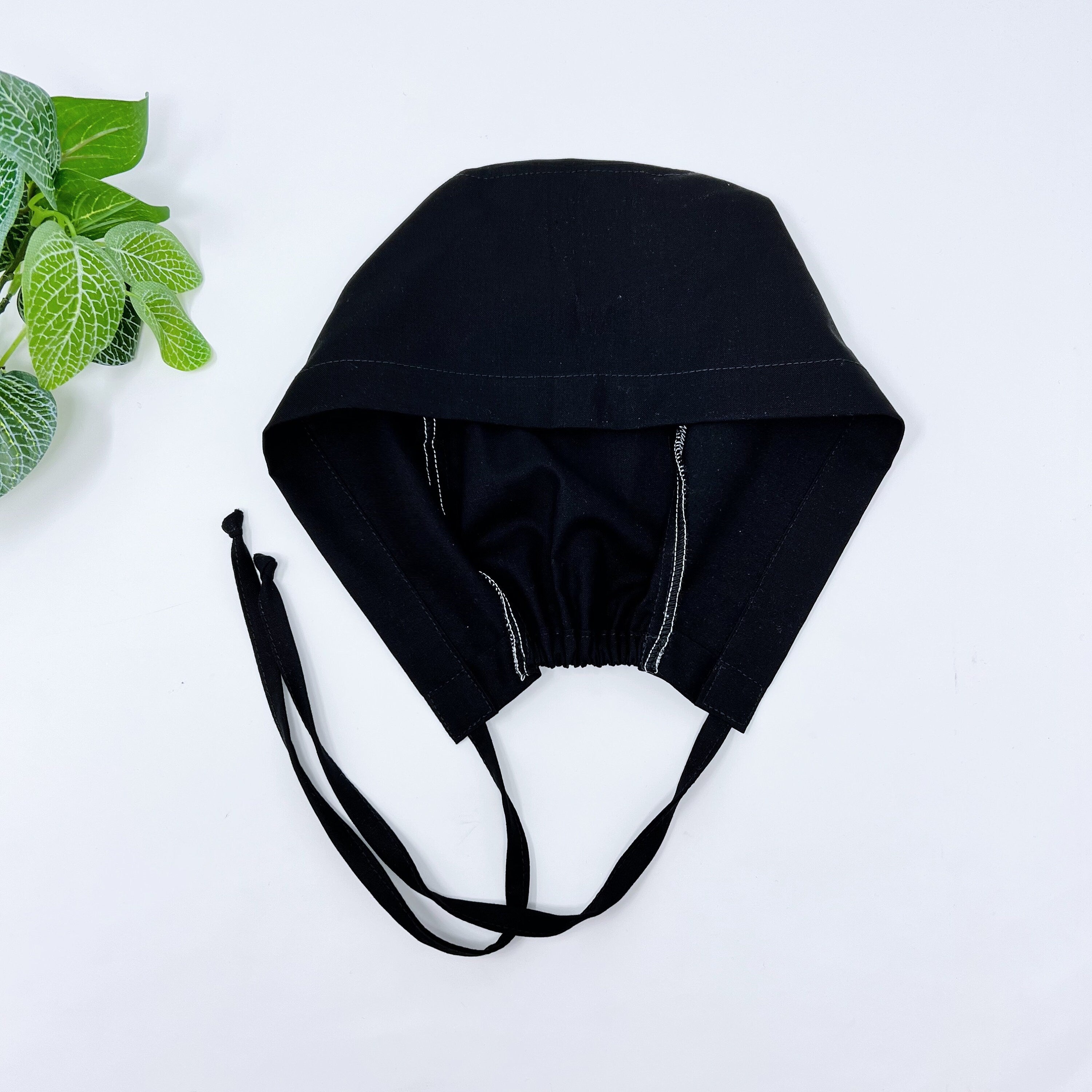 Black Skull tie-back style surgical scrub cap for men by Paradise Caps.